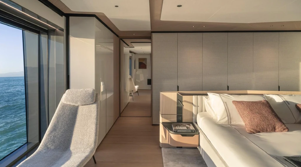 a room with a bed and a window aboard ILMA Yacht for Charter