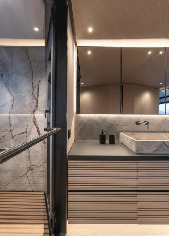 a bathroom with a sink and a mirror aboard ILMA Yacht for Charter