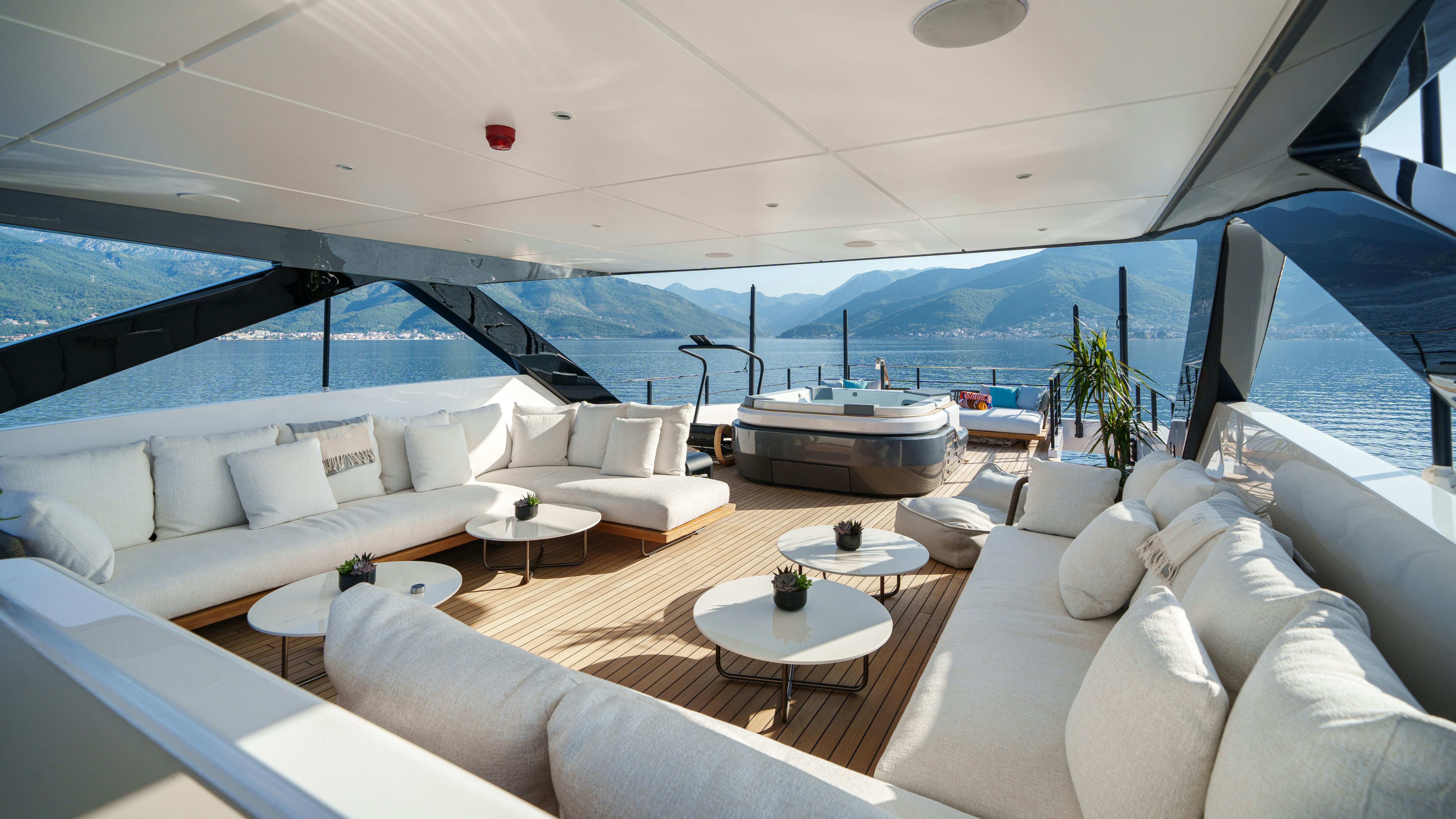 a large living room with a large balcony aboard FIFI Yacht for Charter