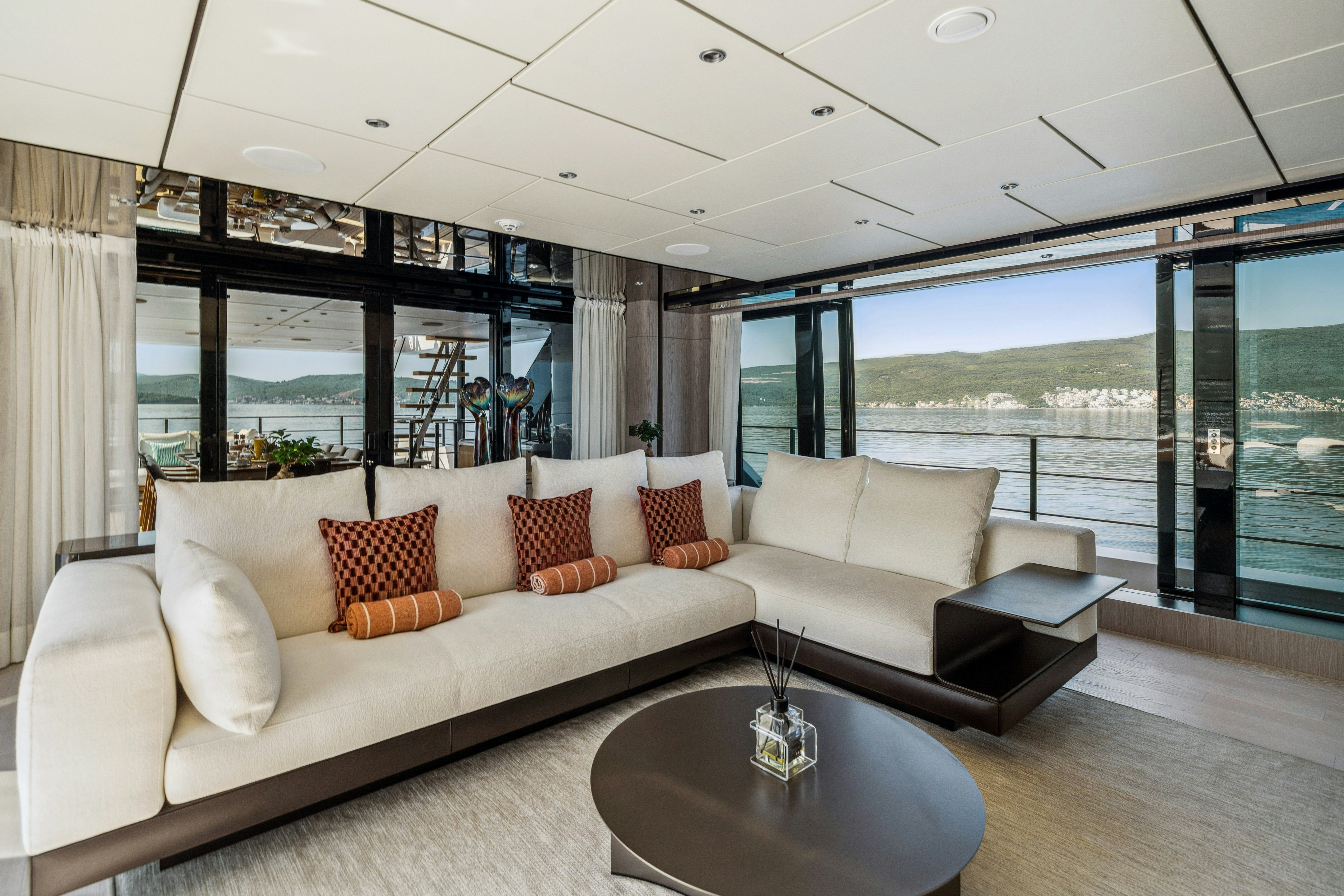 a living room with a large window aboard FIFI Yacht for Charter