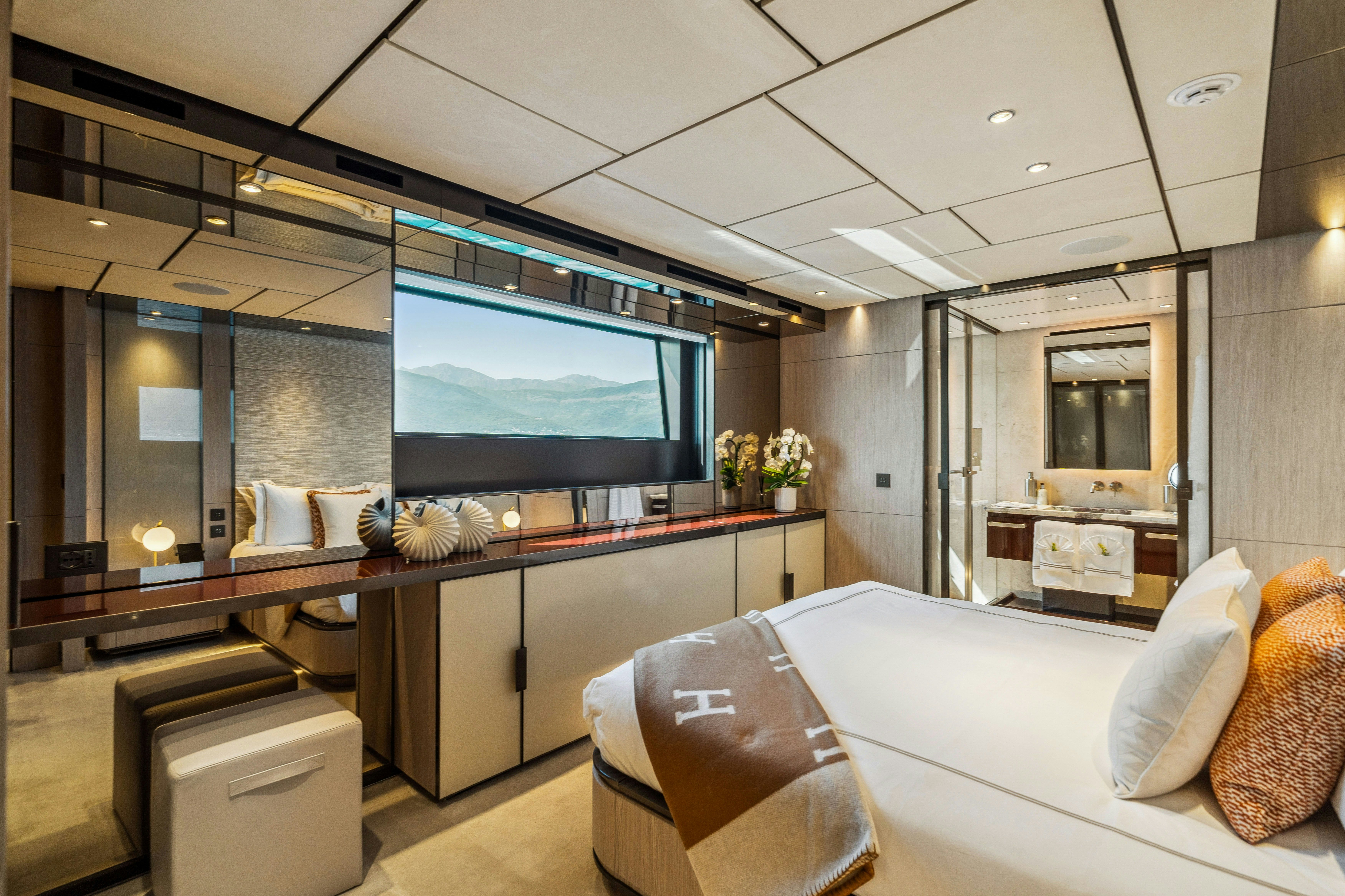a room with a bed and a tv aboard FIFI Yacht for Charter
