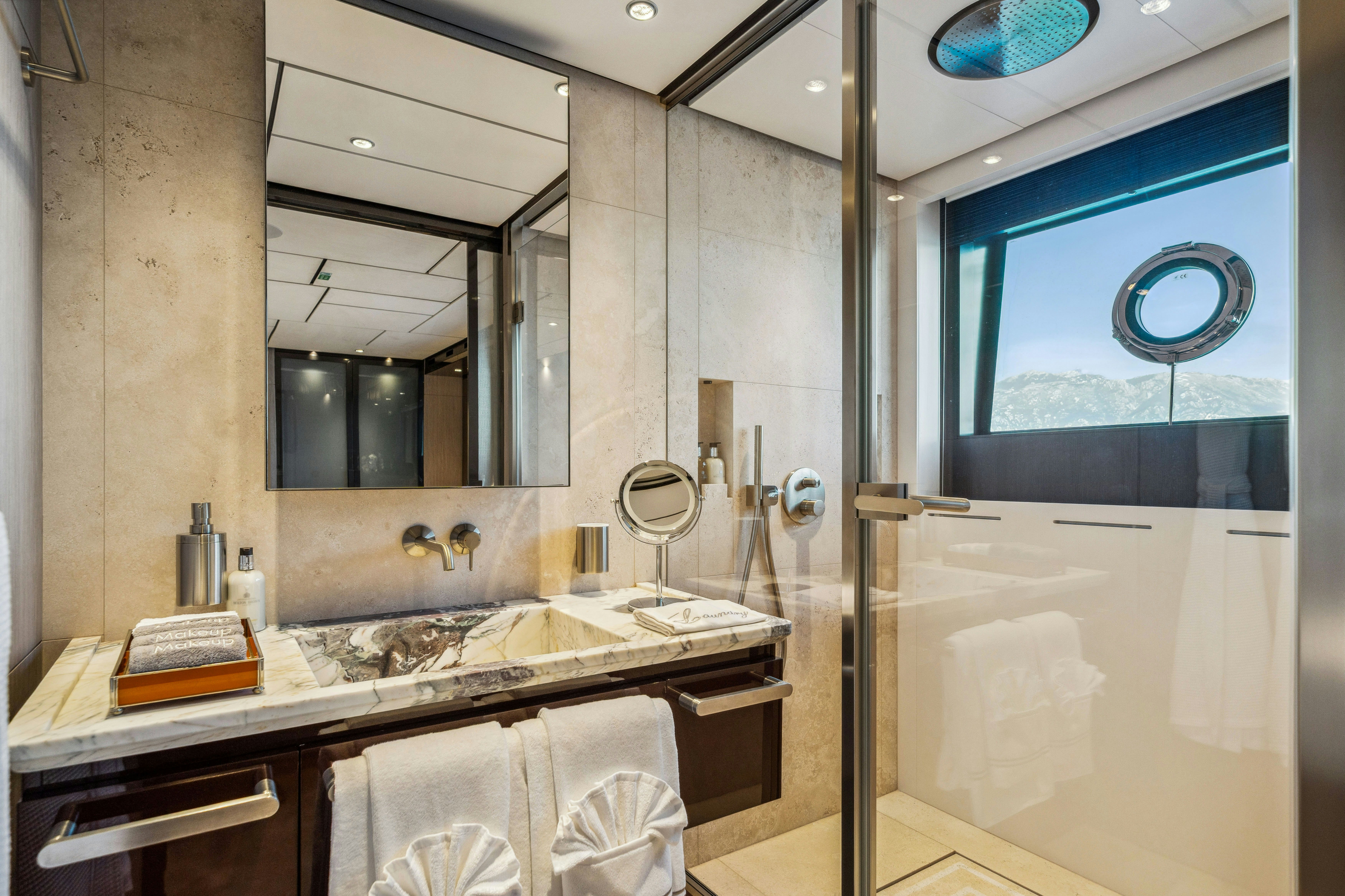 a bathroom with a large mirror aboard FIFI Yacht for Charter