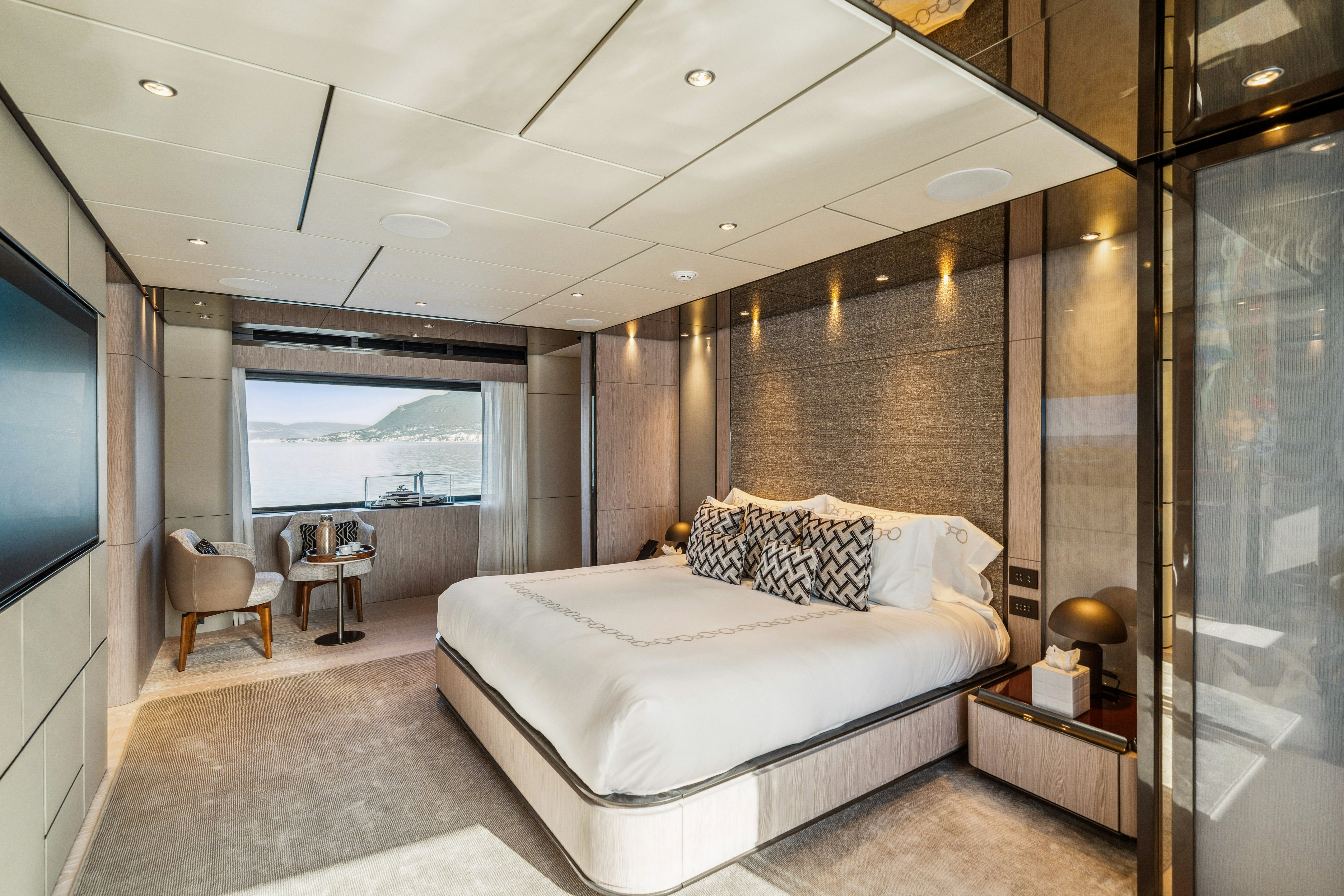 a bedroom with a large bed aboard FIFI Yacht for Charter