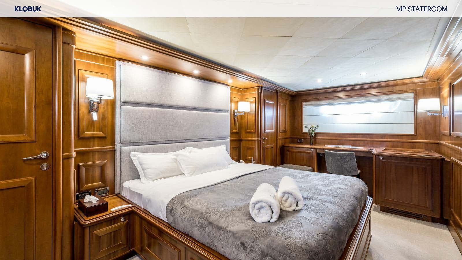 a bed in a room aboard KLOBUK Yacht for Charter