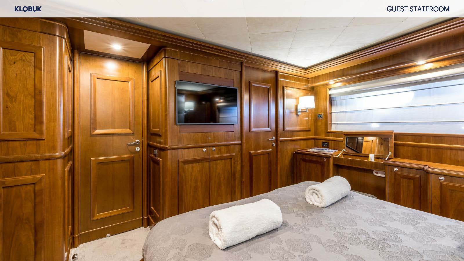 a bed in a room aboard KLOBUK Yacht for Charter