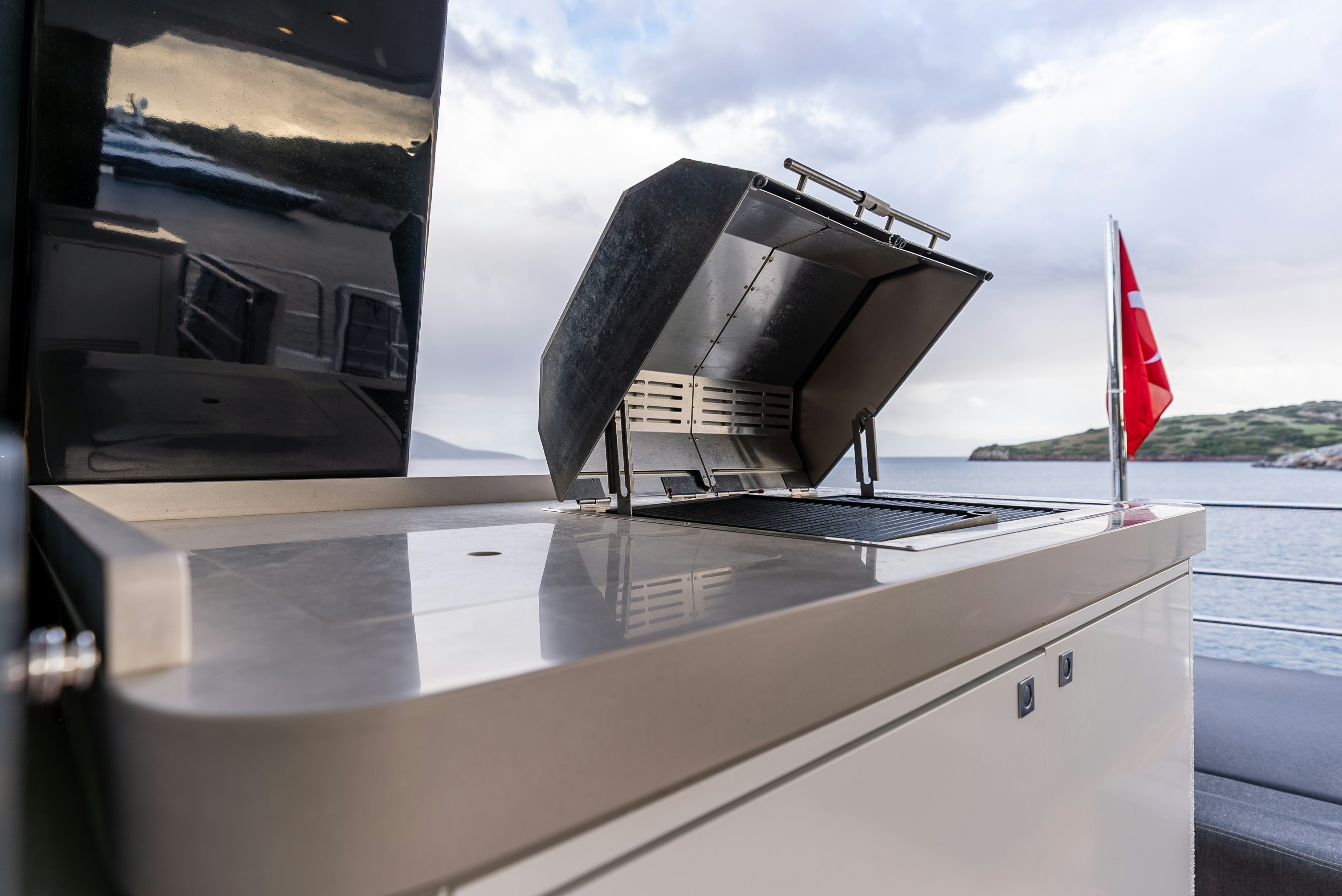 a boat with a flag on it aboard GALENE IV Yacht for Sale