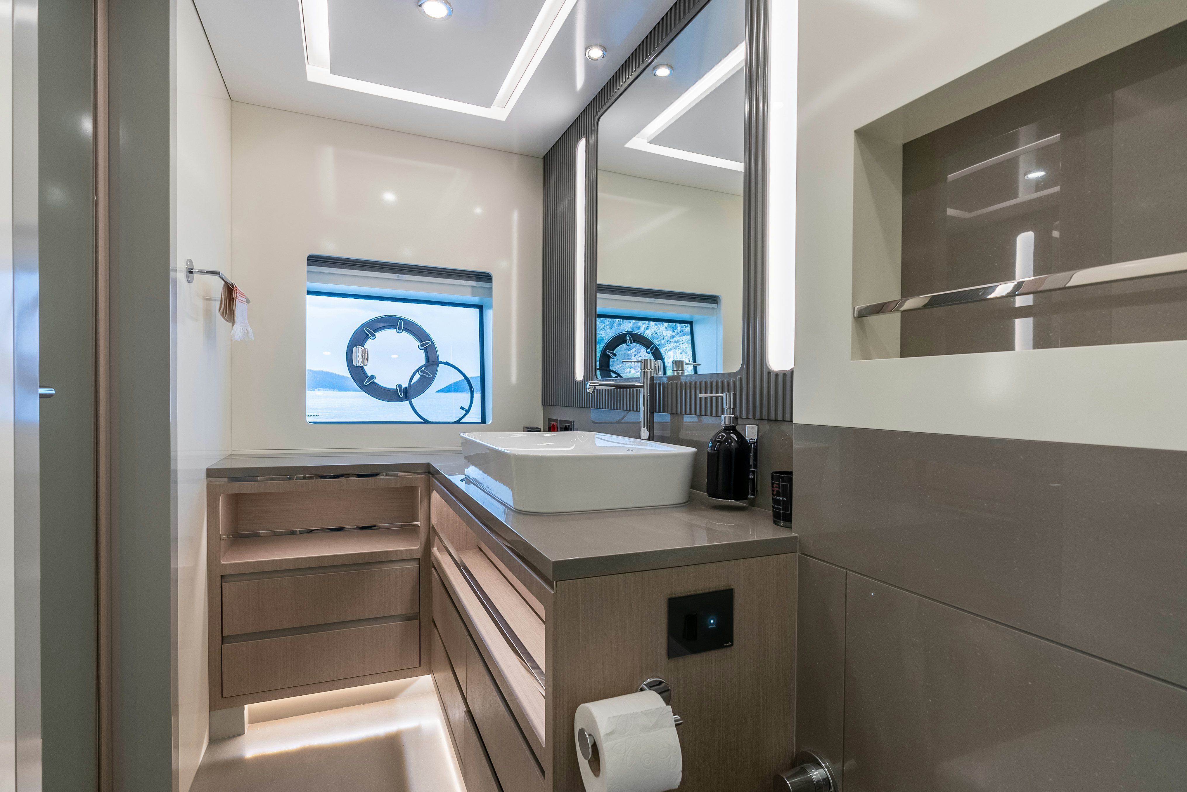 a bathroom with a sink and a tv aboard GALENE IV Yacht for Sale
