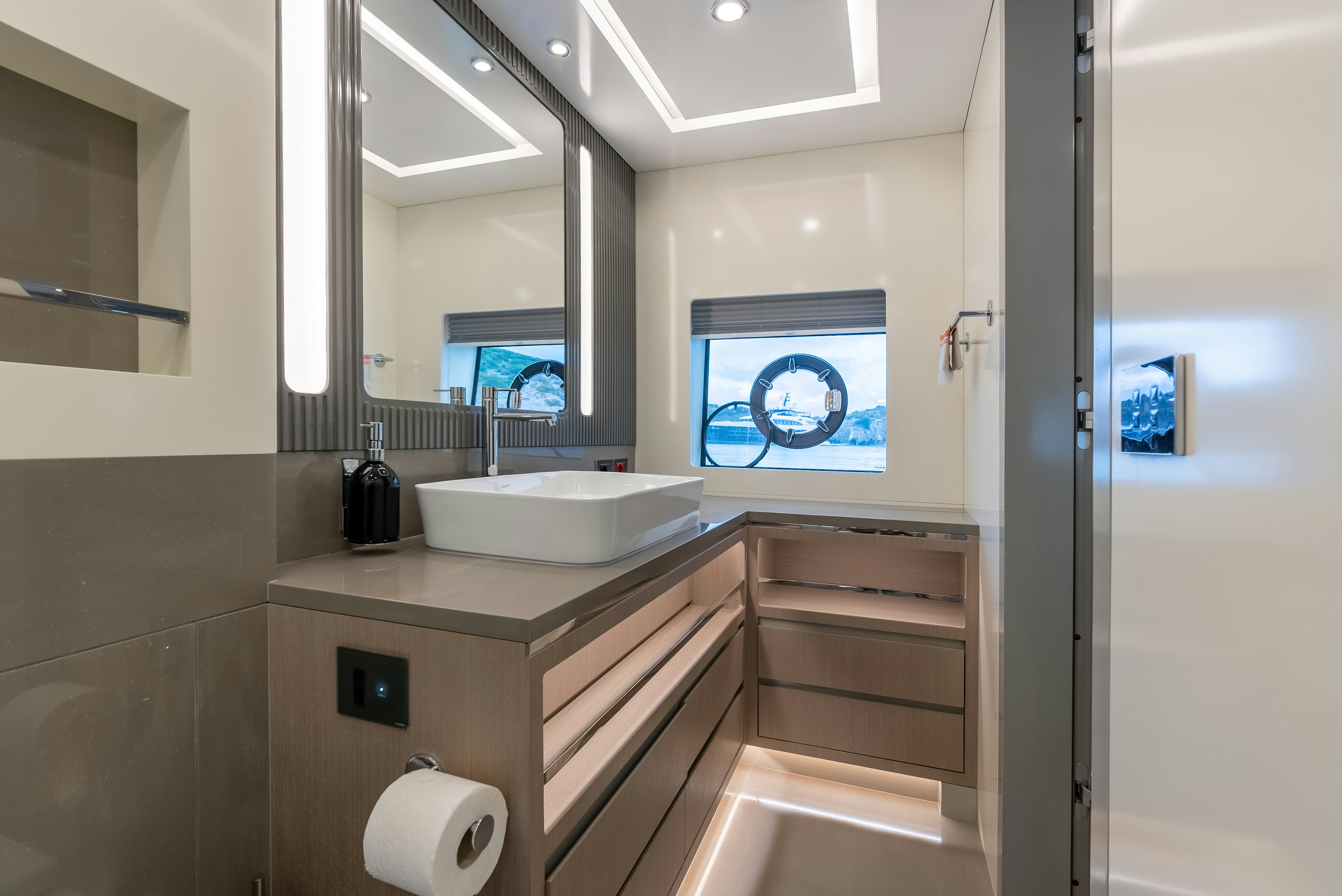 a bathroom with a sink and a mirror aboard GALENE IV Yacht for Sale