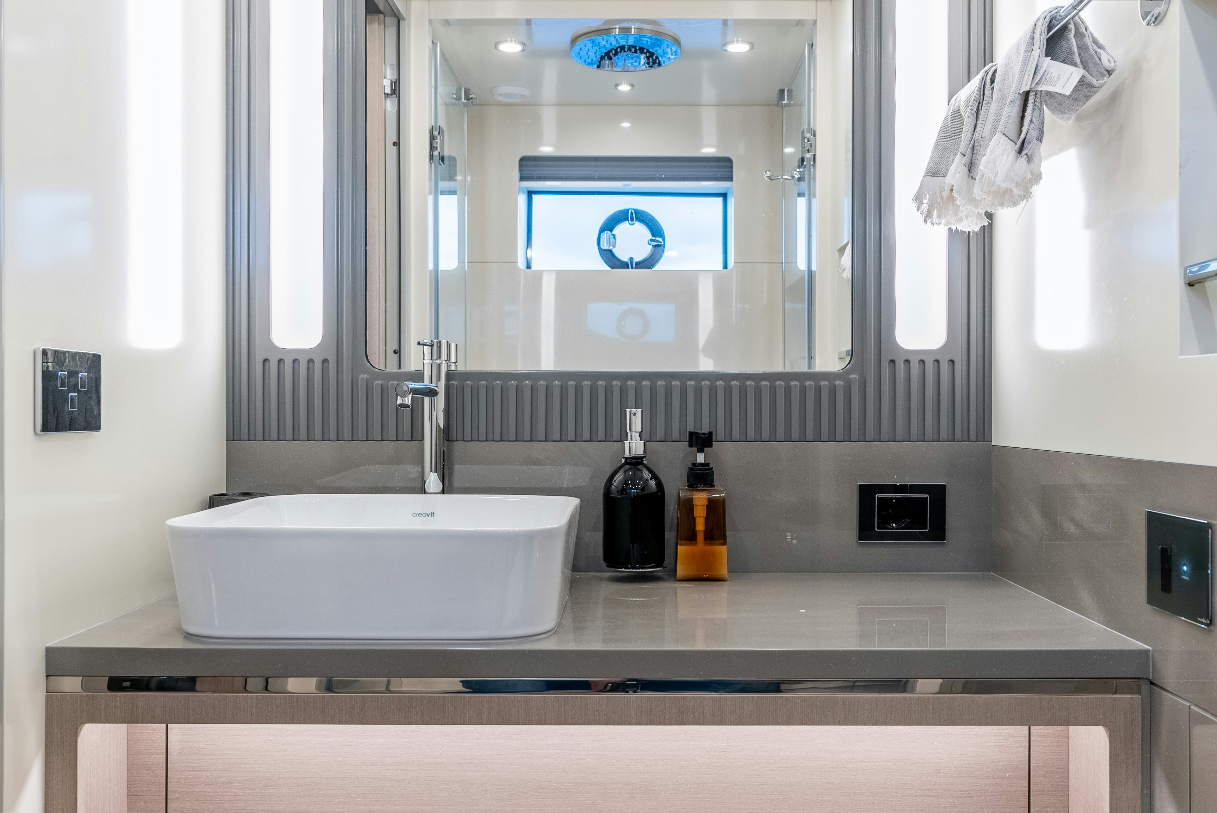 a bathroom with a sink and a mirror aboard GALENE IV Yacht for Sale