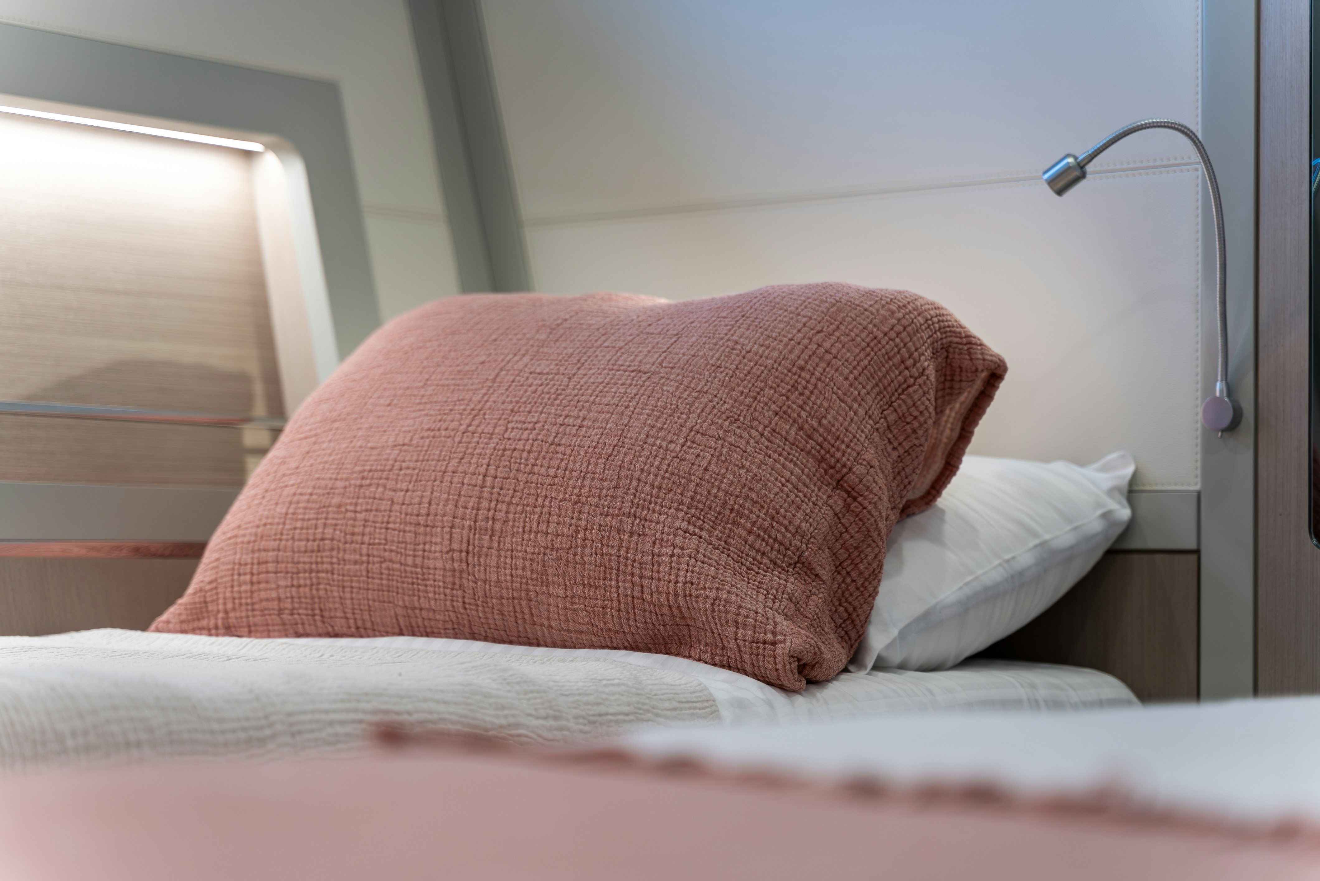 a pink pillow on a bed aboard GALENE IV Yacht for Sale