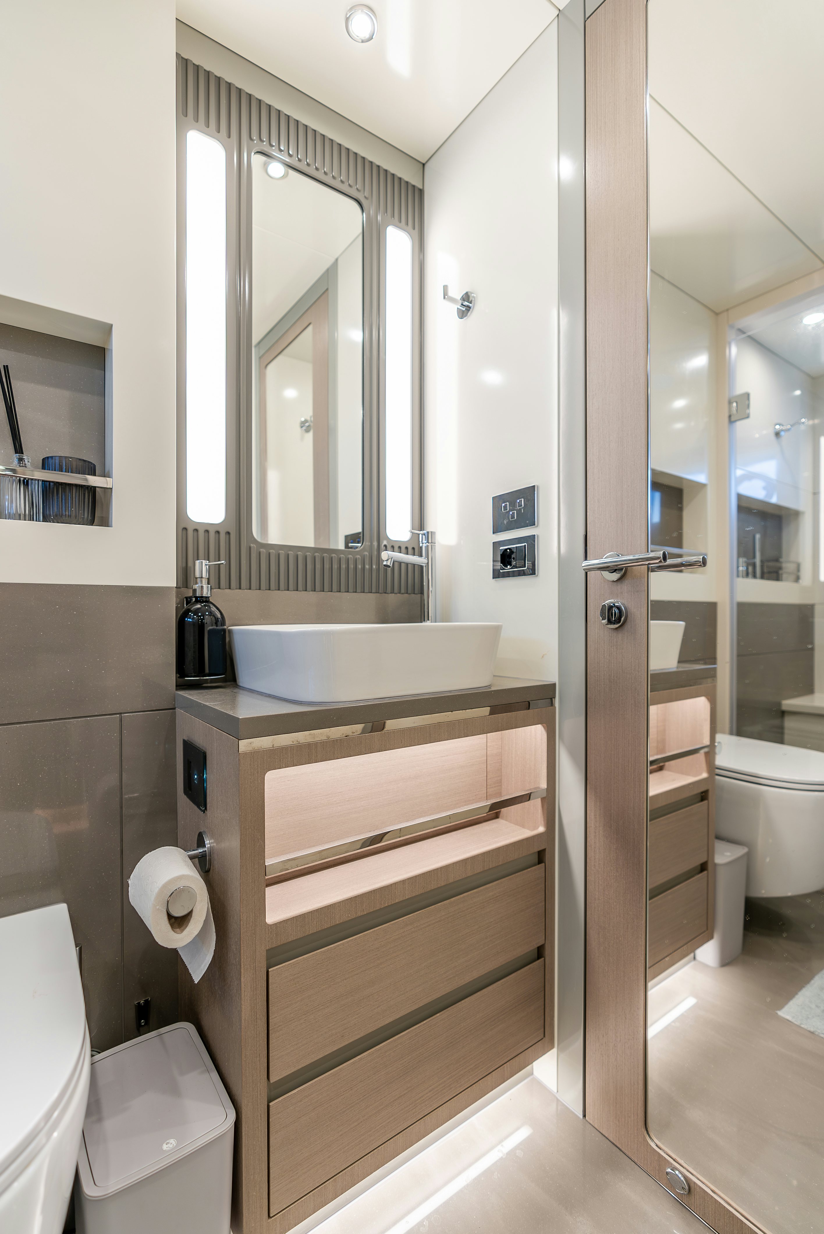 a bathroom with a sink and a mirror aboard GALENE IV Yacht for Sale