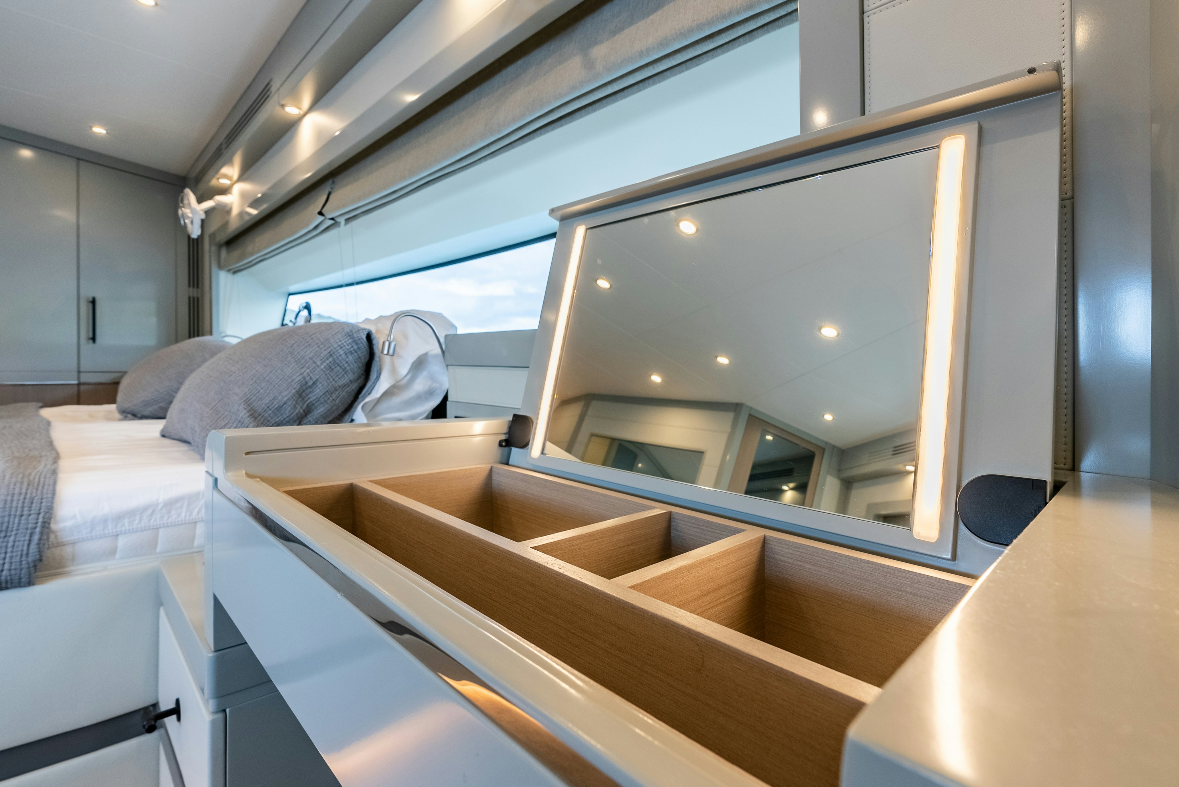 a bed with a large mirror aboard GALENE IV Yacht for Sale