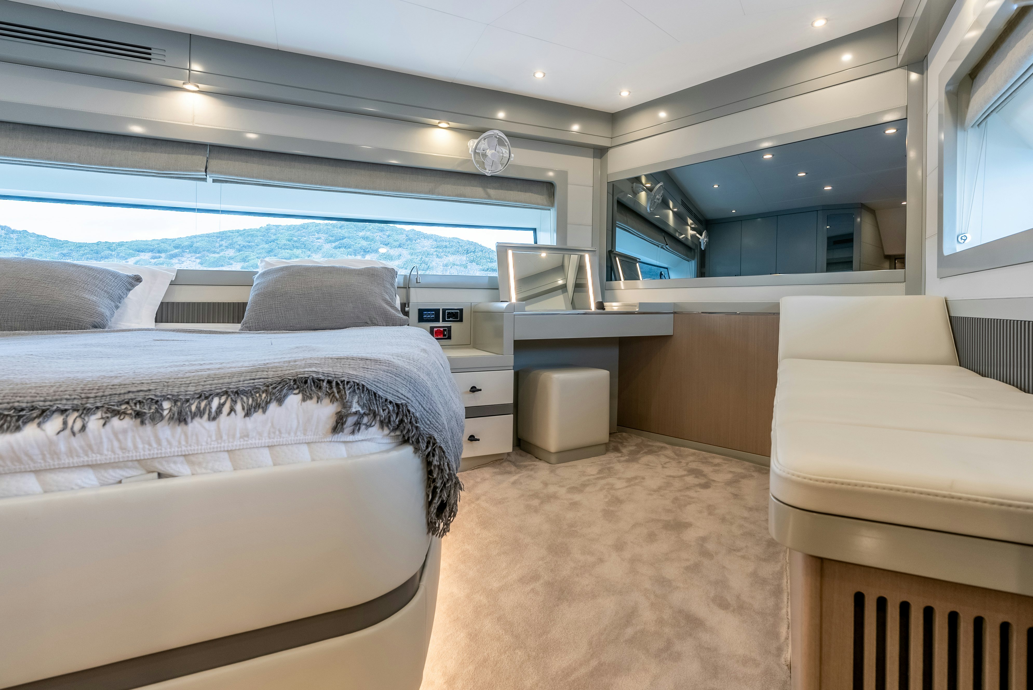 a room with a bed and a couch aboard GALENE IV Yacht for Sale