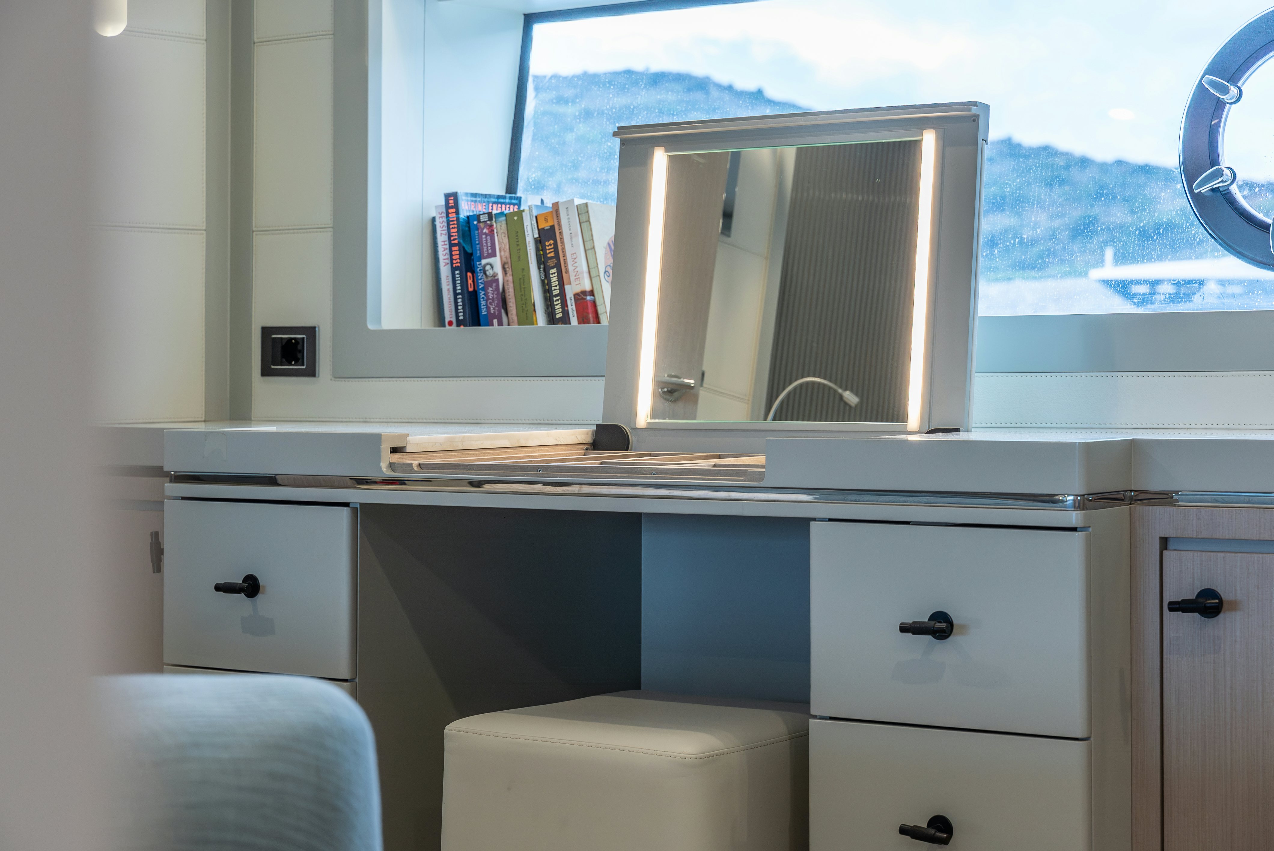 a room with a window and a desk with a window aboard GALENE IV Yacht for Sale