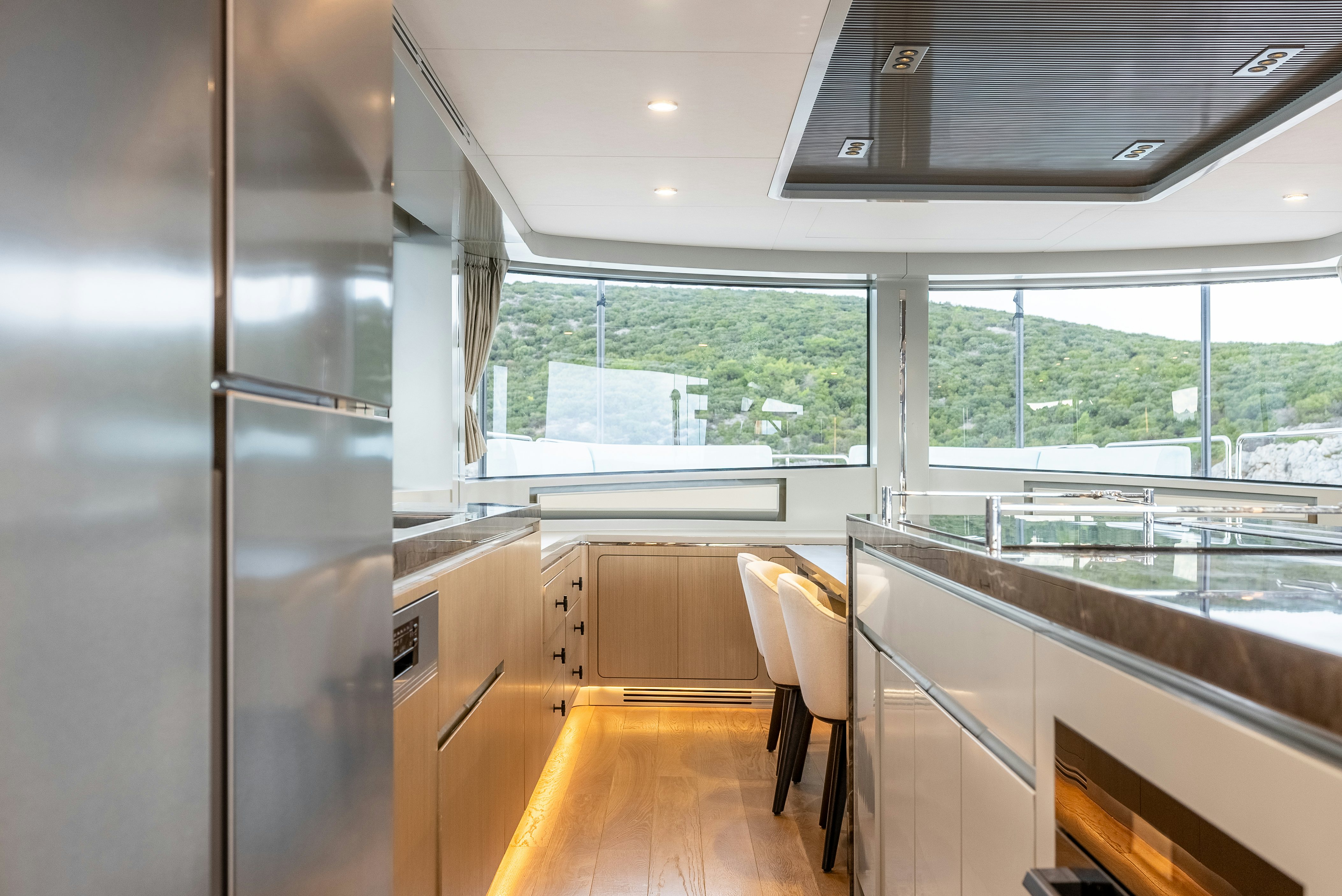 a large kitchen with a large window aboard GALENE IV Yacht for Sale