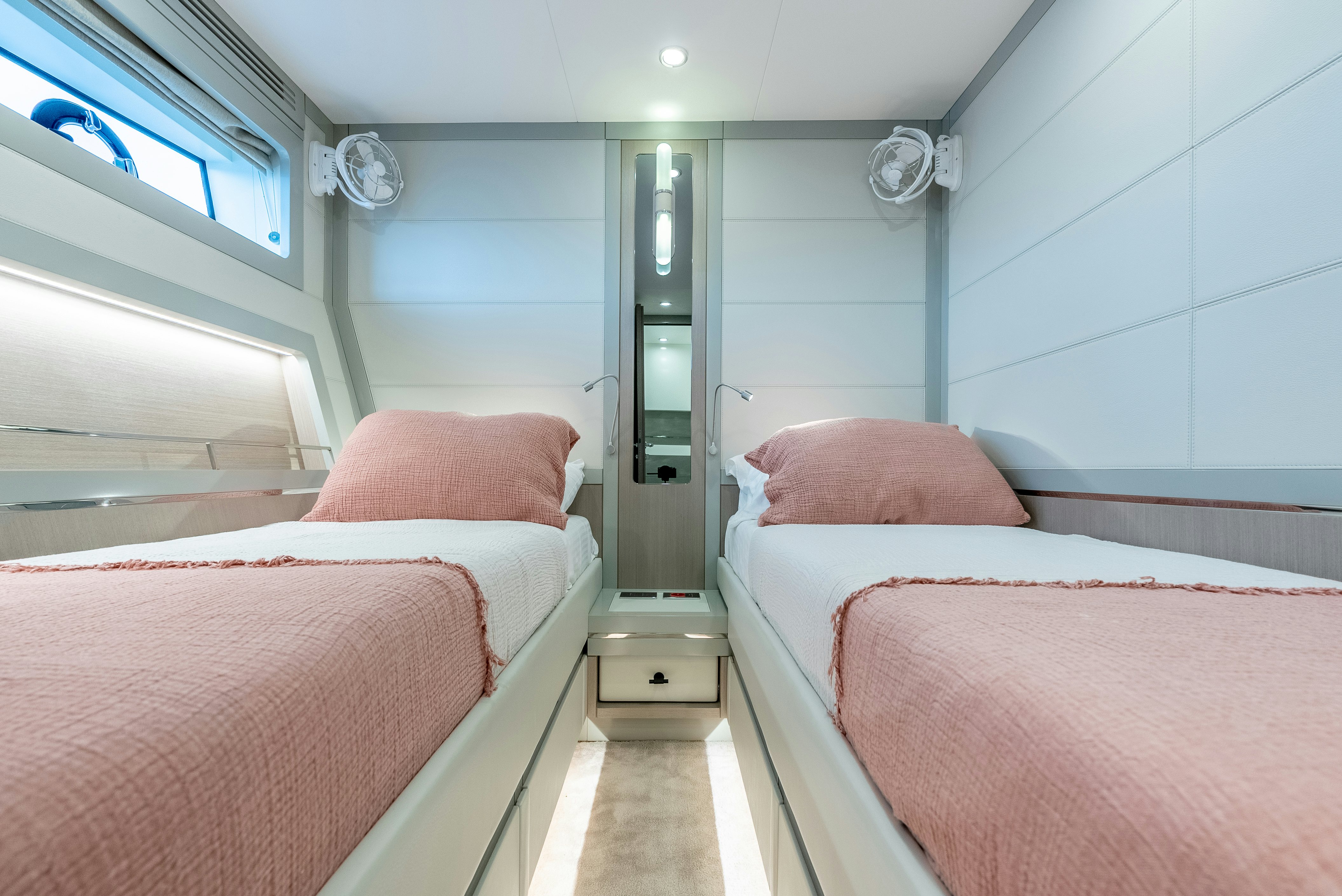 a room with beds and a window aboard GALENE IV Yacht for Sale