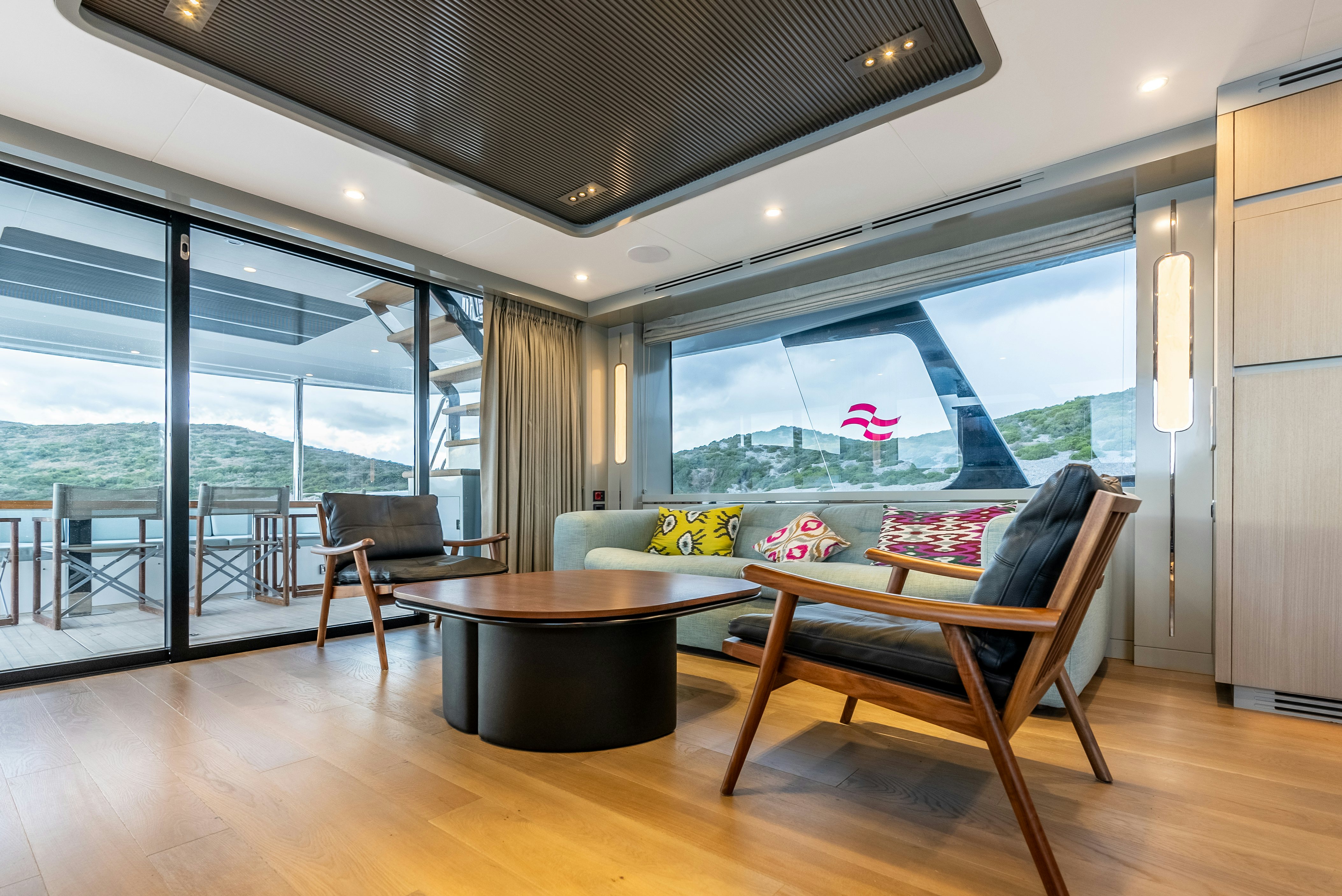 a room with a table and chairs aboard GALENE IV Yacht for Sale