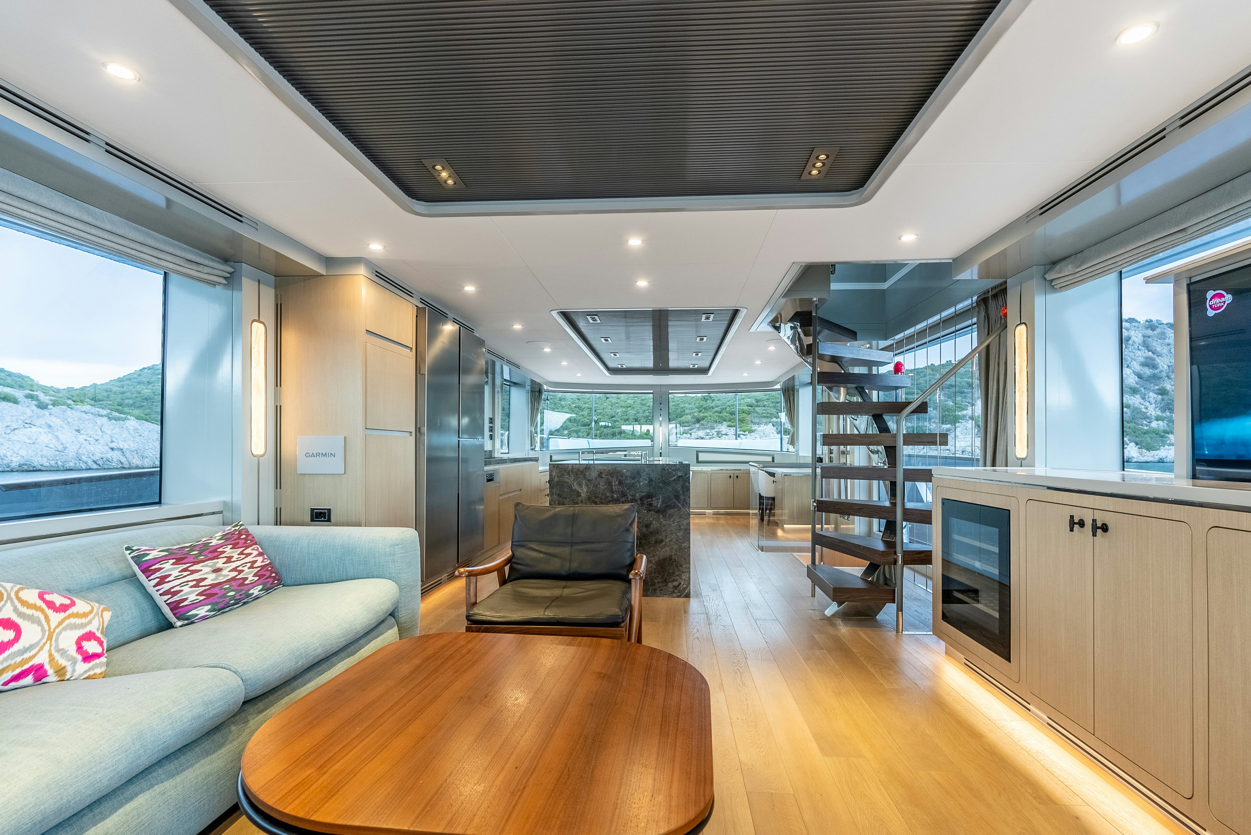 a living room with a large glass window aboard GALENE IV Yacht for Sale