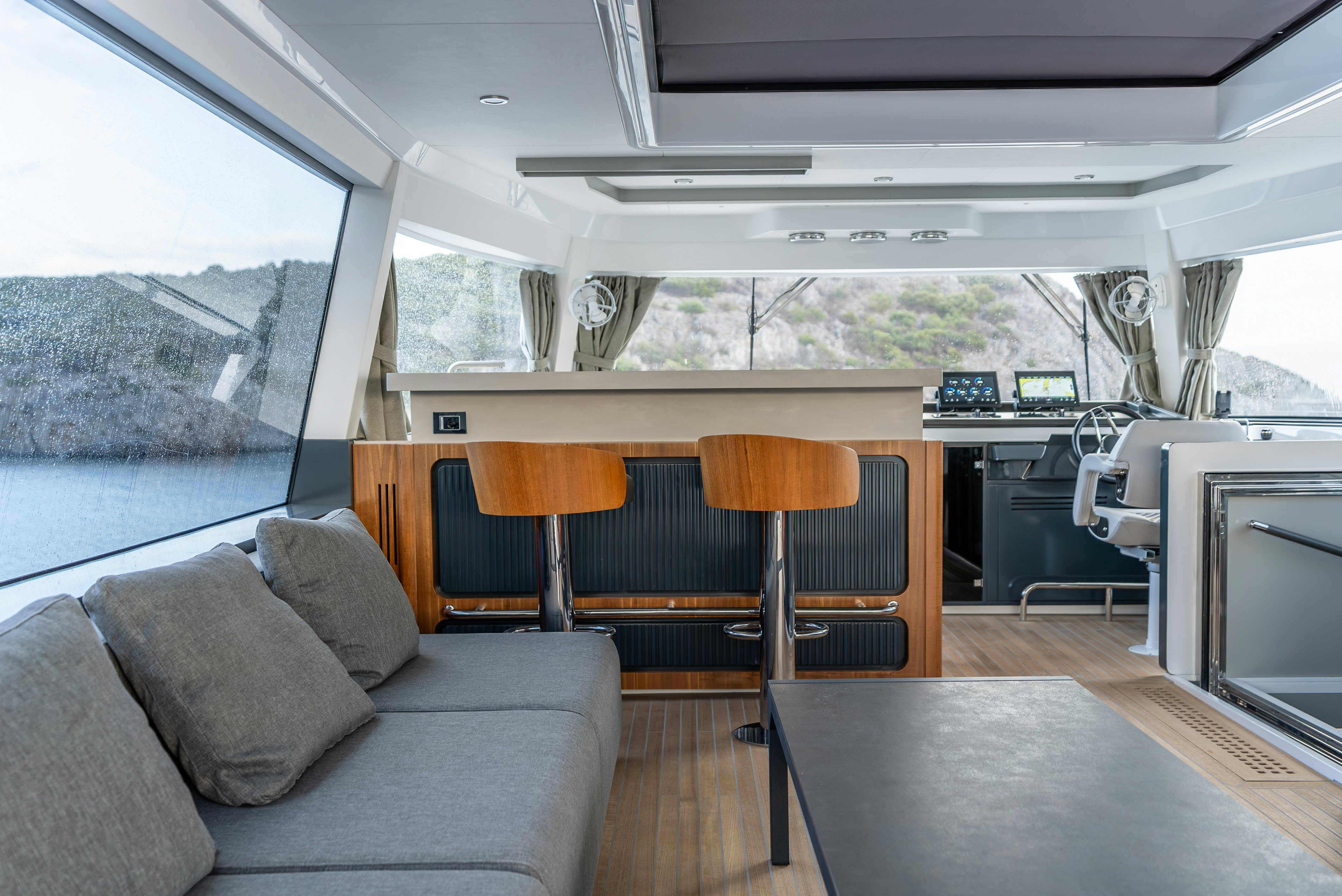 a living room with a couch and a table aboard GALENE IV Yacht for Sale