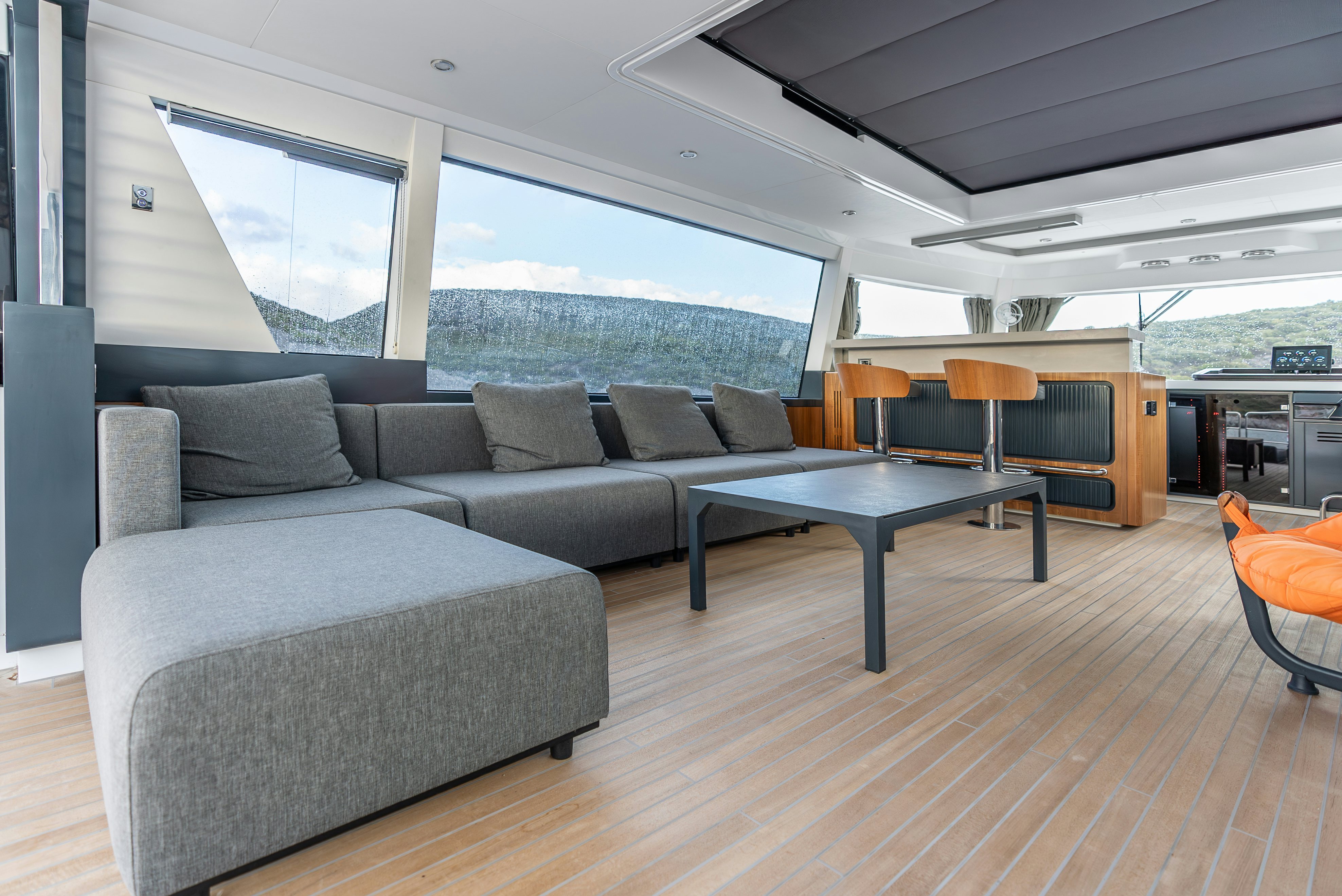 a living room with couches and a table aboard GALENE IV Yacht for Sale