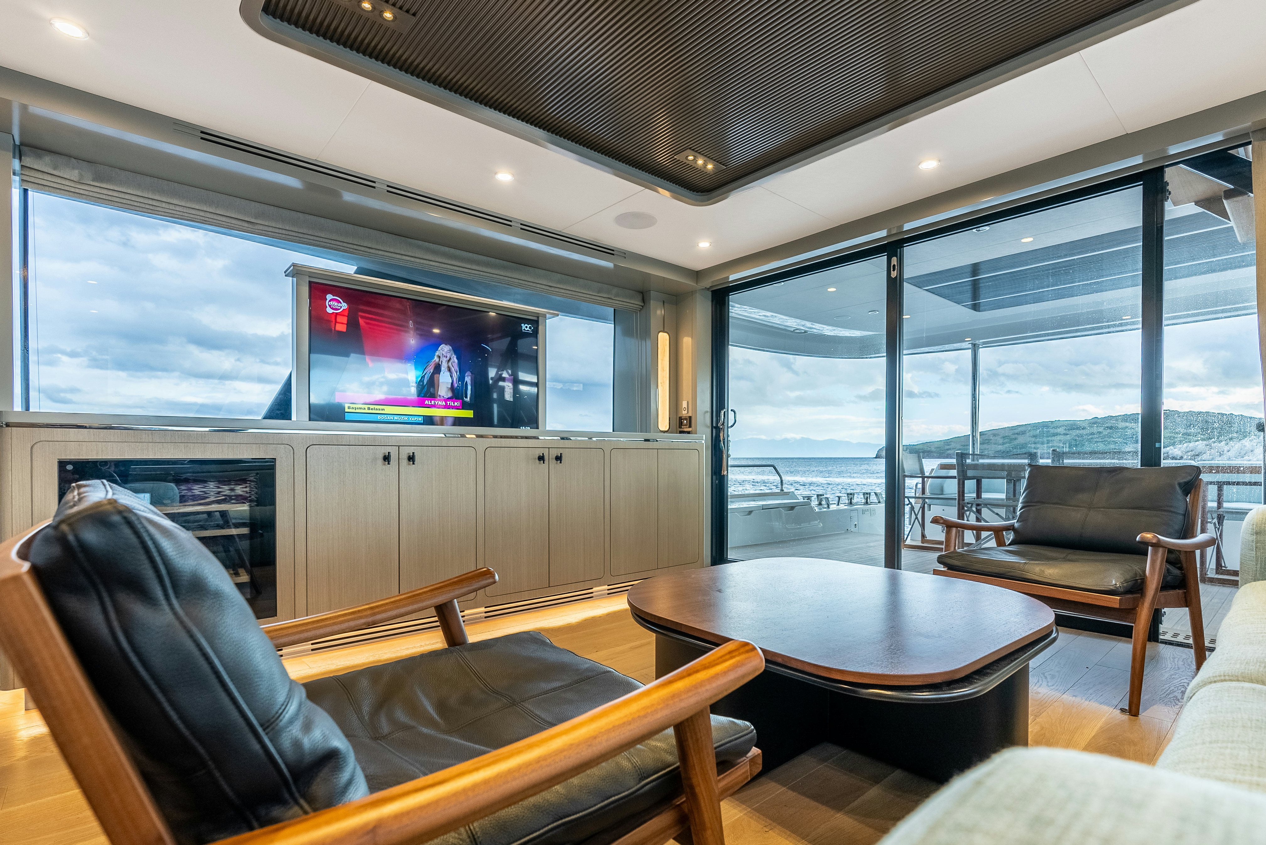 a room with a table and chairs aboard GALENE IV Yacht for Sale
