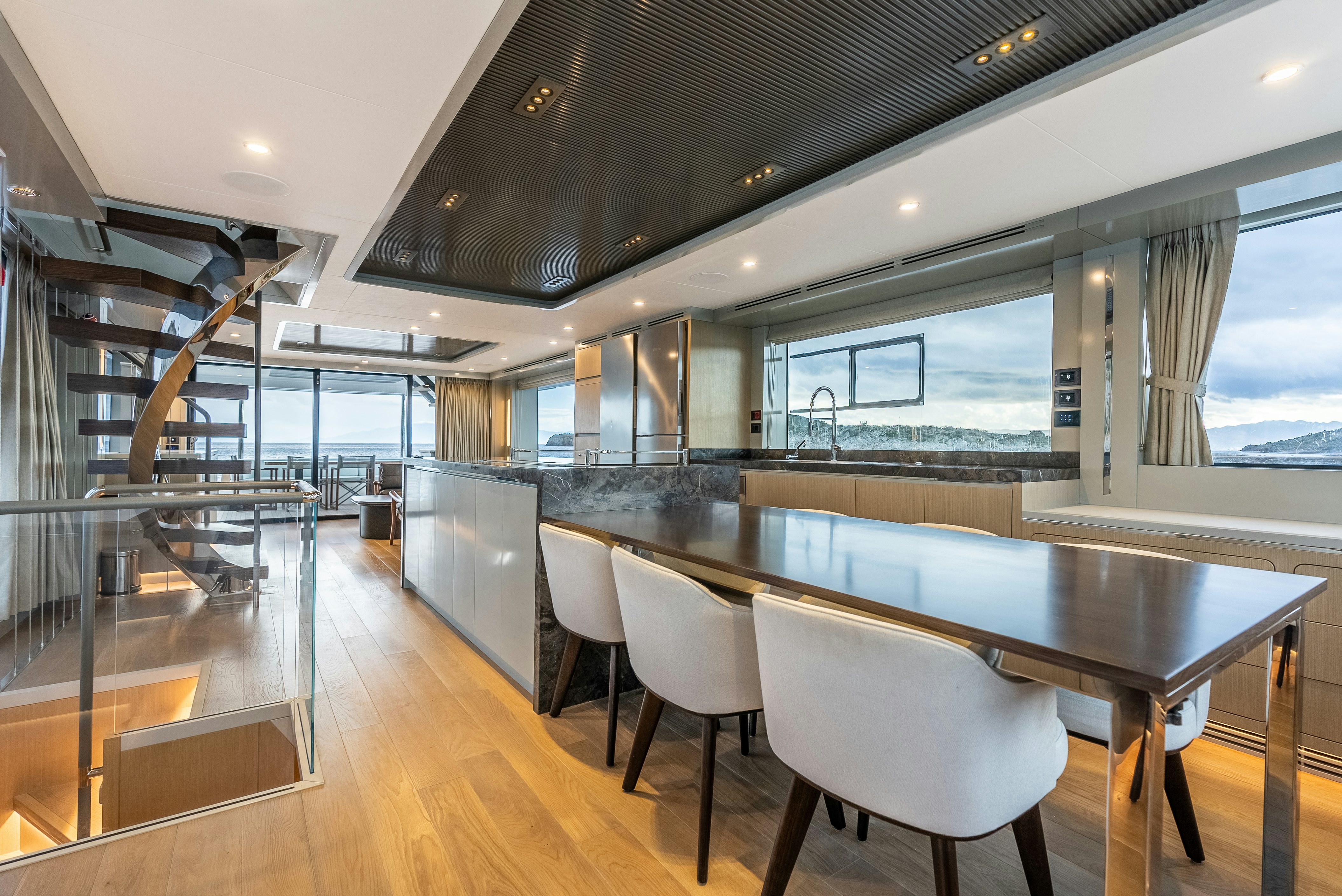 a large kitchen with a large glass window aboard GALENE IV Yacht for Sale