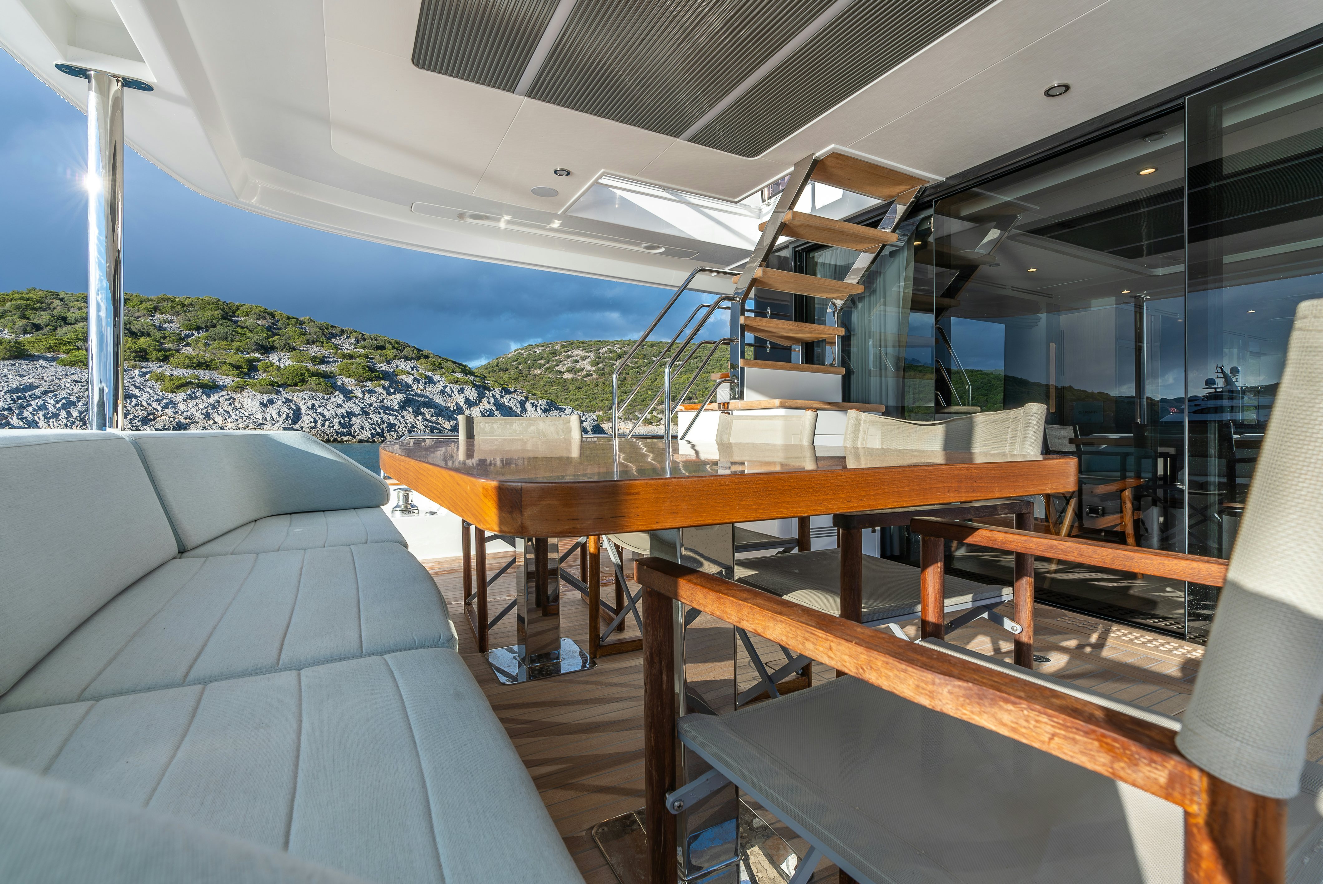 a room with a table and chairs aboard GALENE IV Yacht for Sale