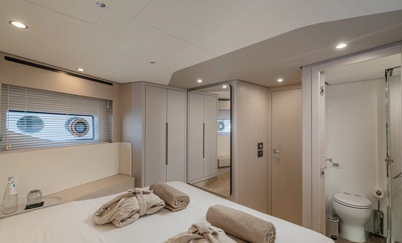 a large white bathroom with a large mirror aboard SBK Yacht for Charter
