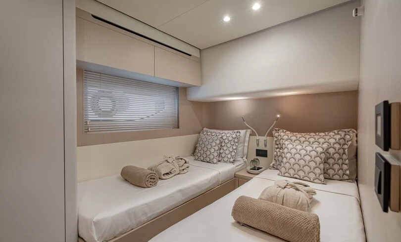 a room with two beds aboard SBK Yacht for Charter