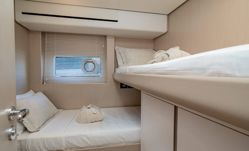 a bed with a mirror above it aboard SBK Yacht for Charter