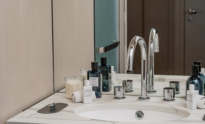 a bathroom sink with a mirror above it aboard SBK Yacht for Charter