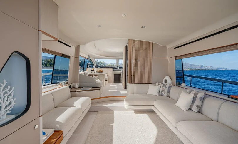 a living room with a large window aboard SBK Yacht for Charter