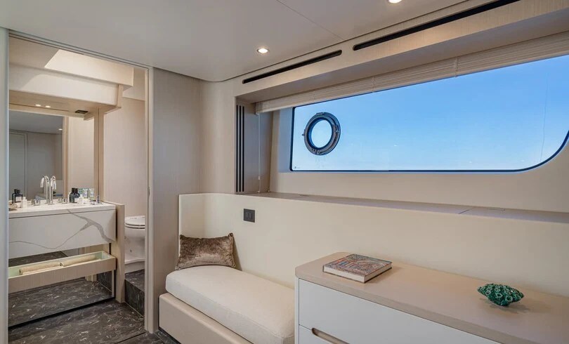 a room with a bed and a desk aboard SBK Yacht for Charter
