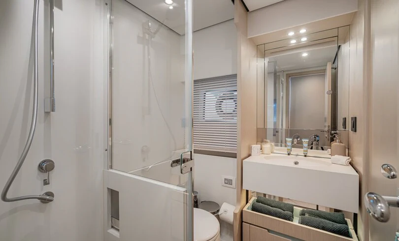 a bathroom with a sink and a bathtub aboard SBK Yacht for Charter
