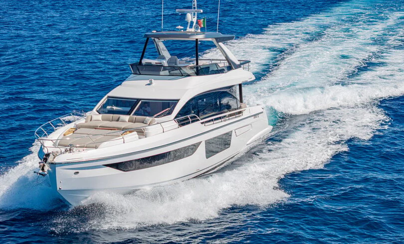 a white boat on the water aboard SBK Yacht for Charter
