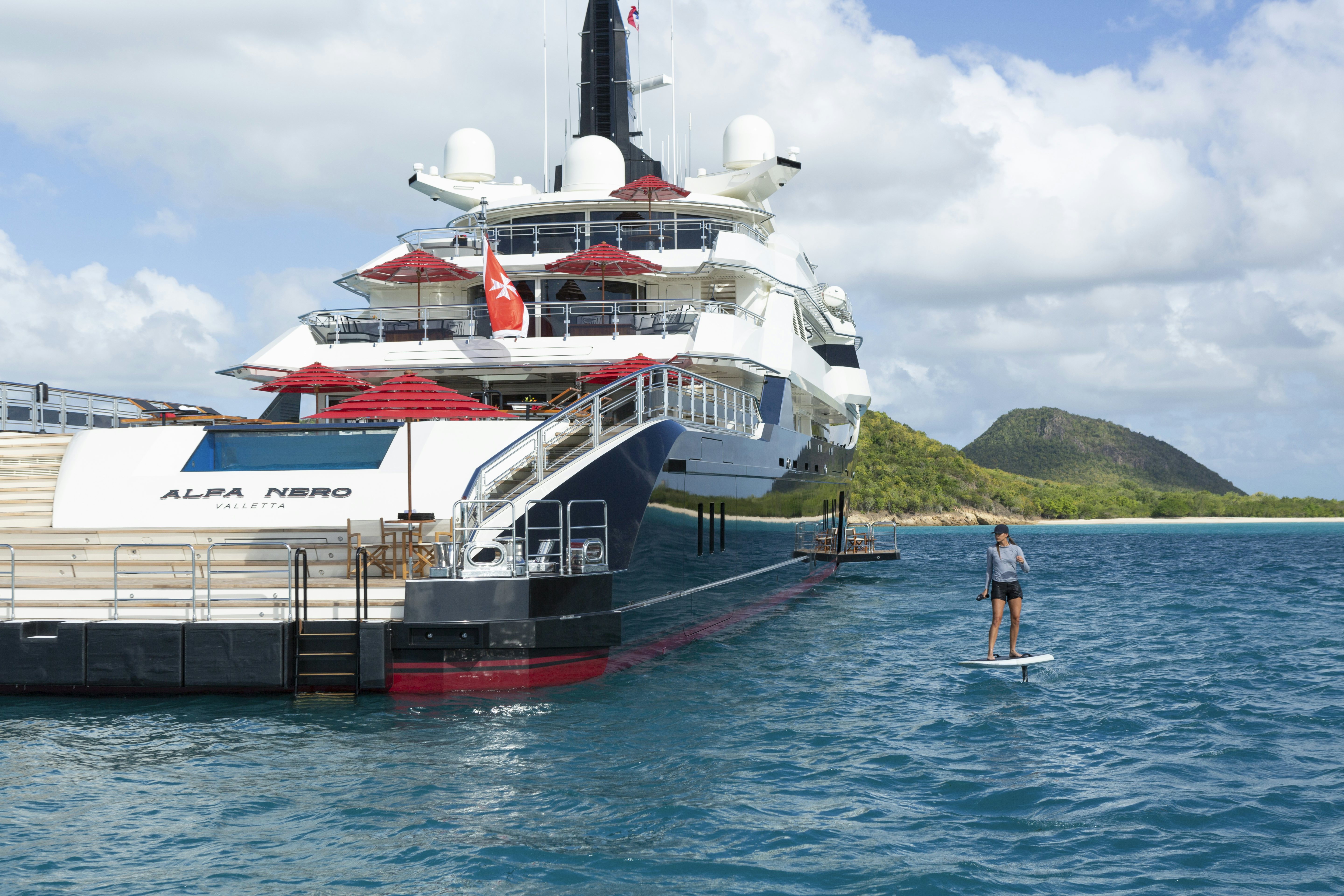 a large white boat in the water aboard ALFA NERO Yacht for Charter