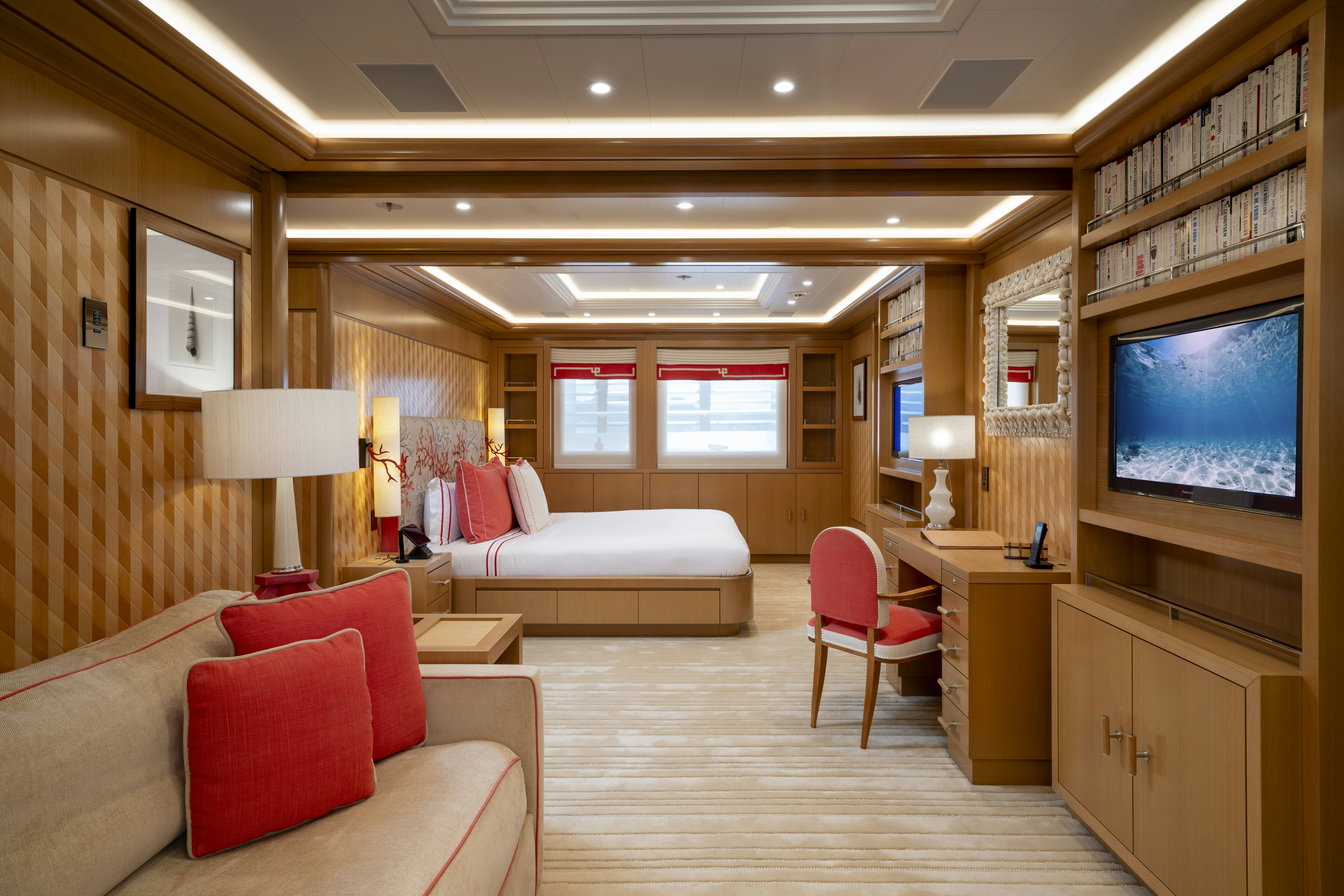 a room with a couch and a tv on the wall aboard ALFA NERO Yacht for Charter