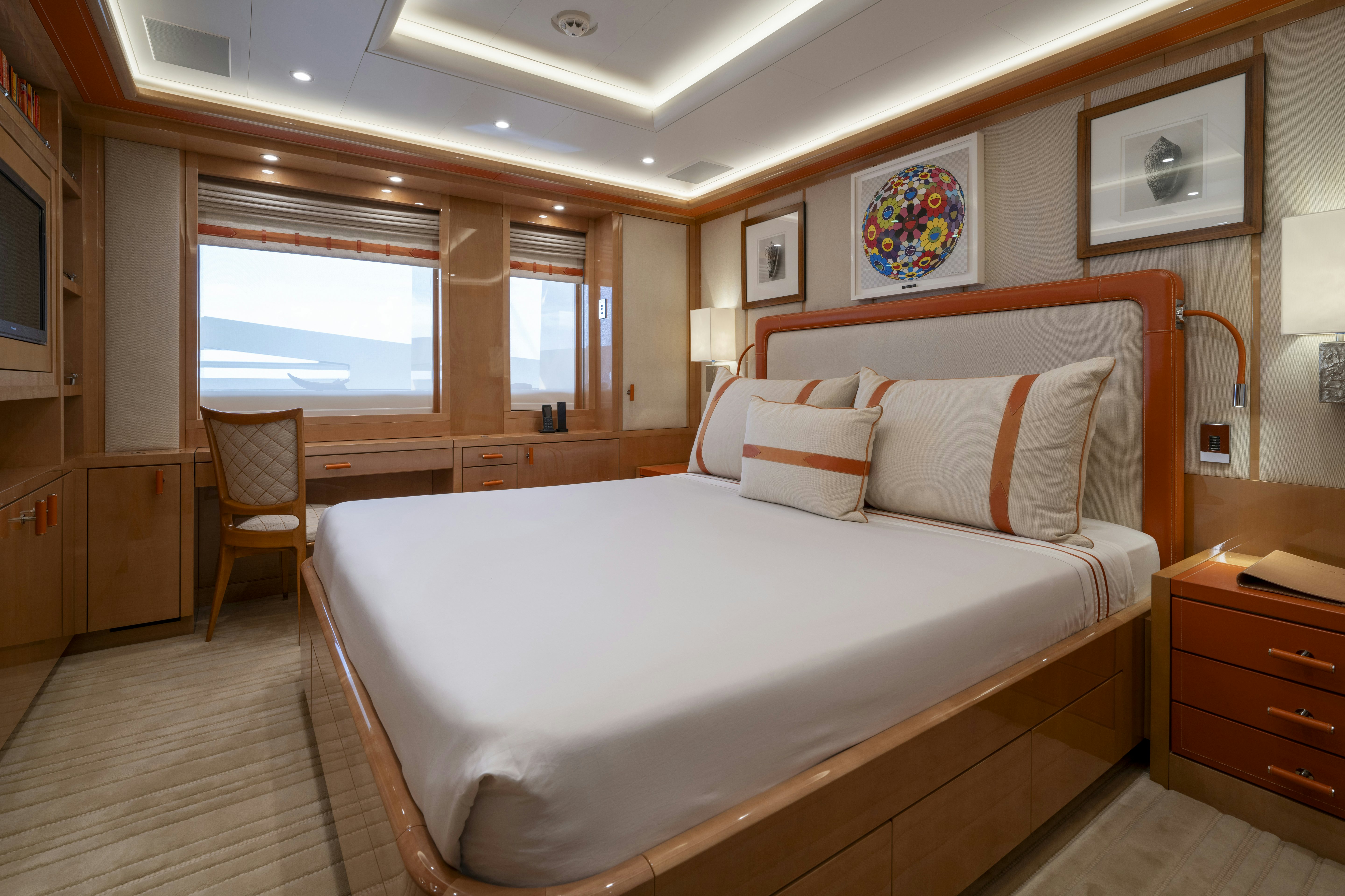 a bedroom with a bed and a window aboard ALFA NERO Yacht for Charter