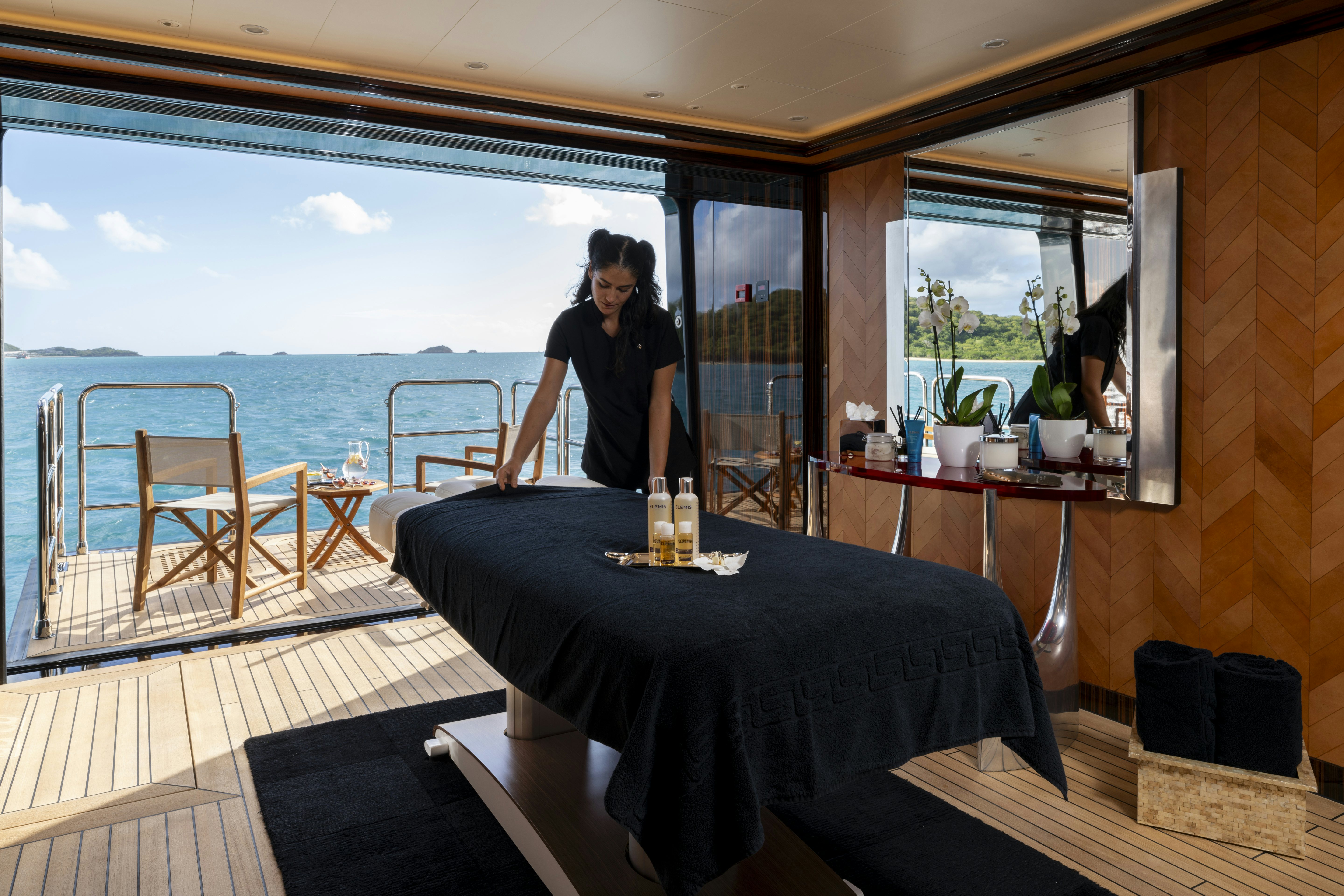 a person sitting at a table aboard ALFA NERO Yacht for Charter