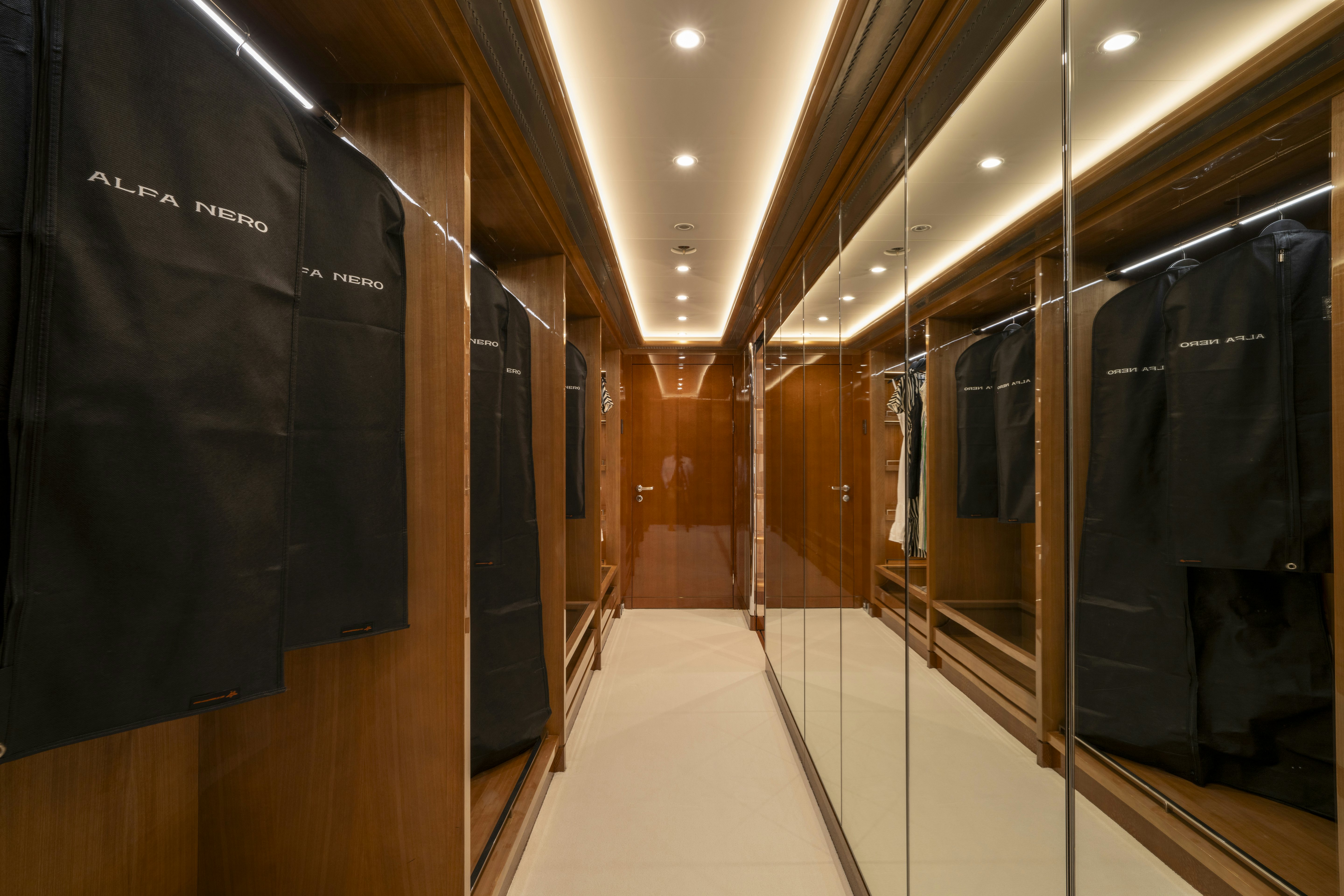 a hallway with a few black lockers aboard ALFA NERO Yacht for Charter
