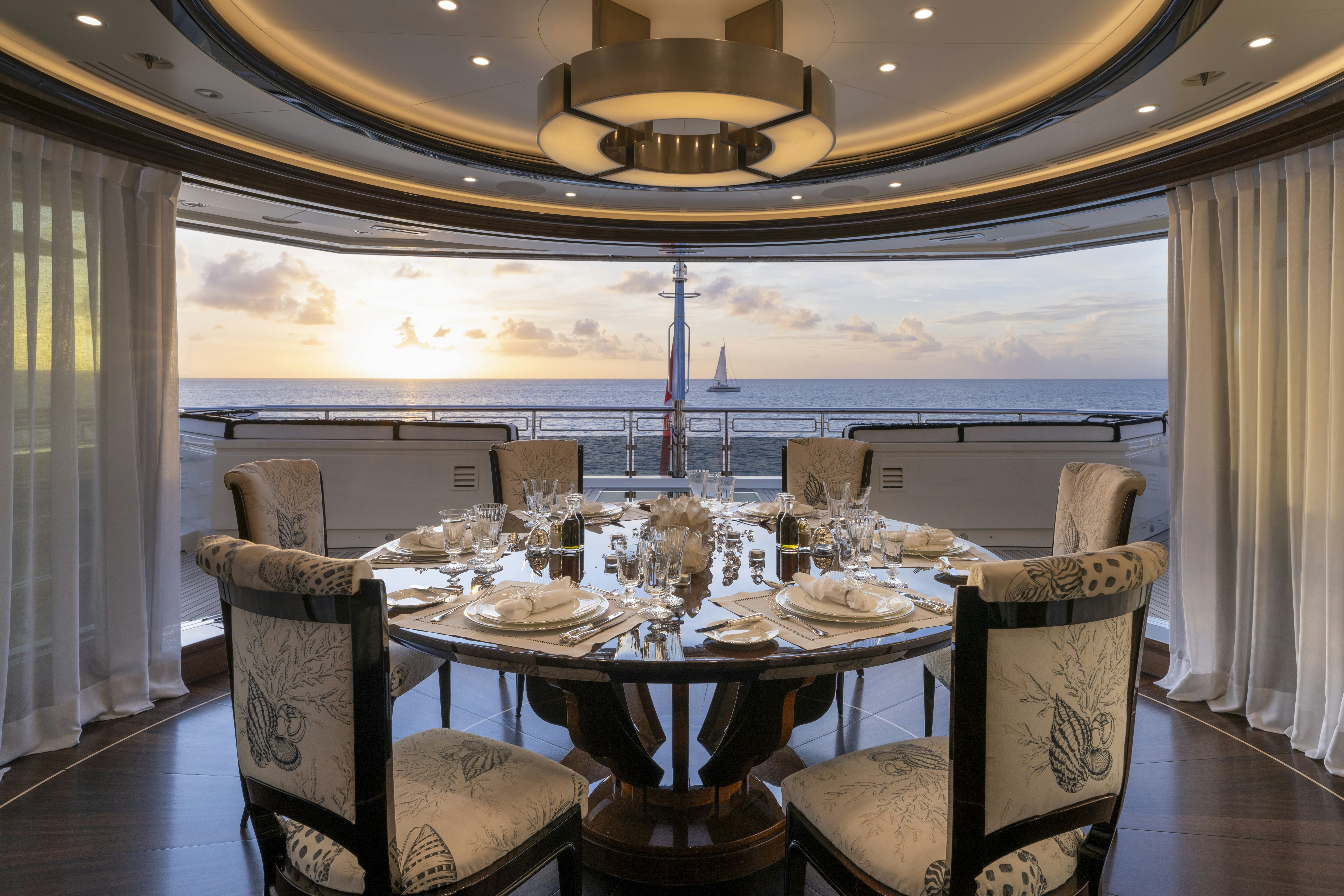 a dining table set for a dinner aboard ALFA NERO Yacht for Charter