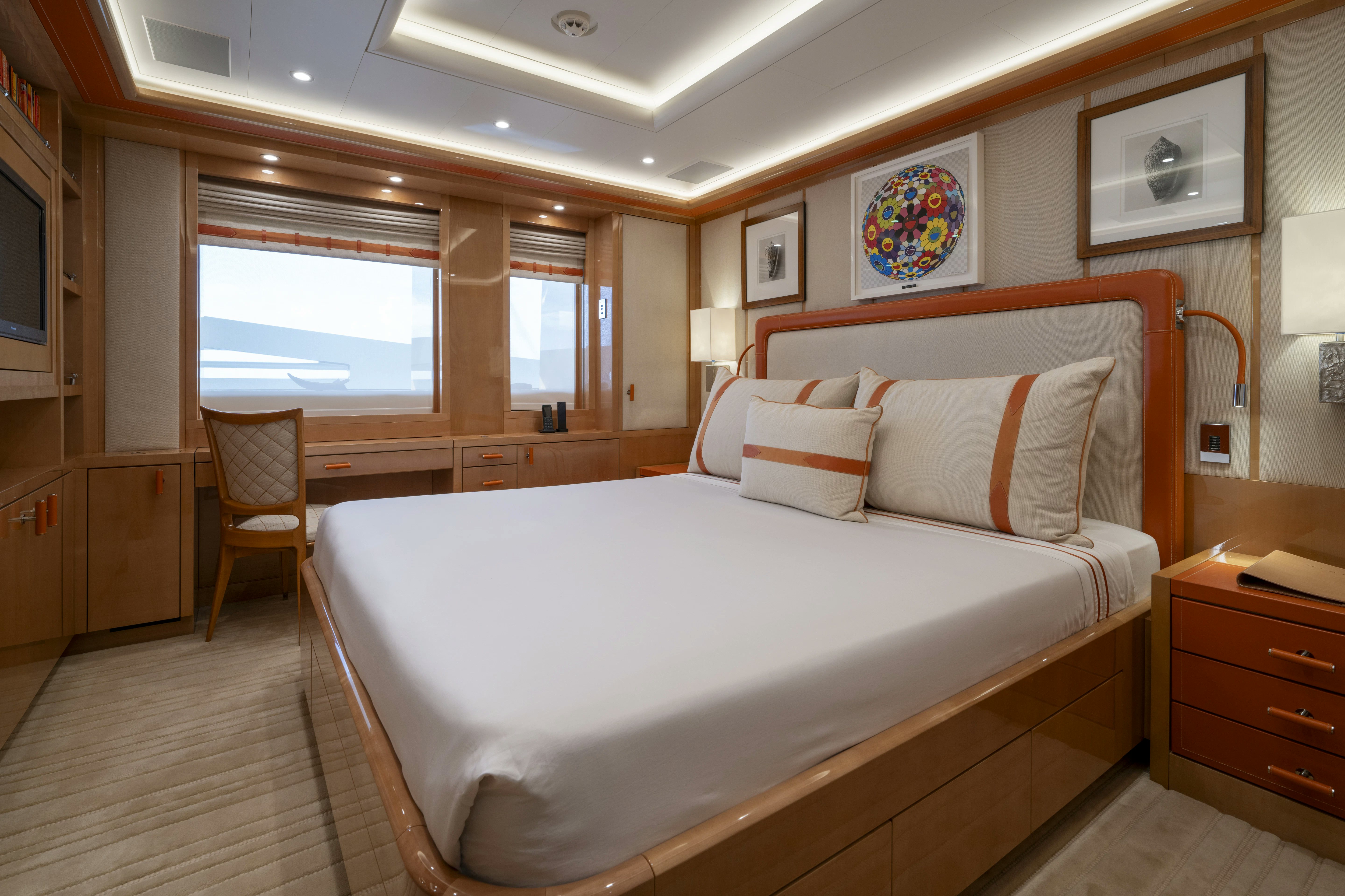 a bedroom with a bed and a window aboard ALFA NERO Yacht for Sale