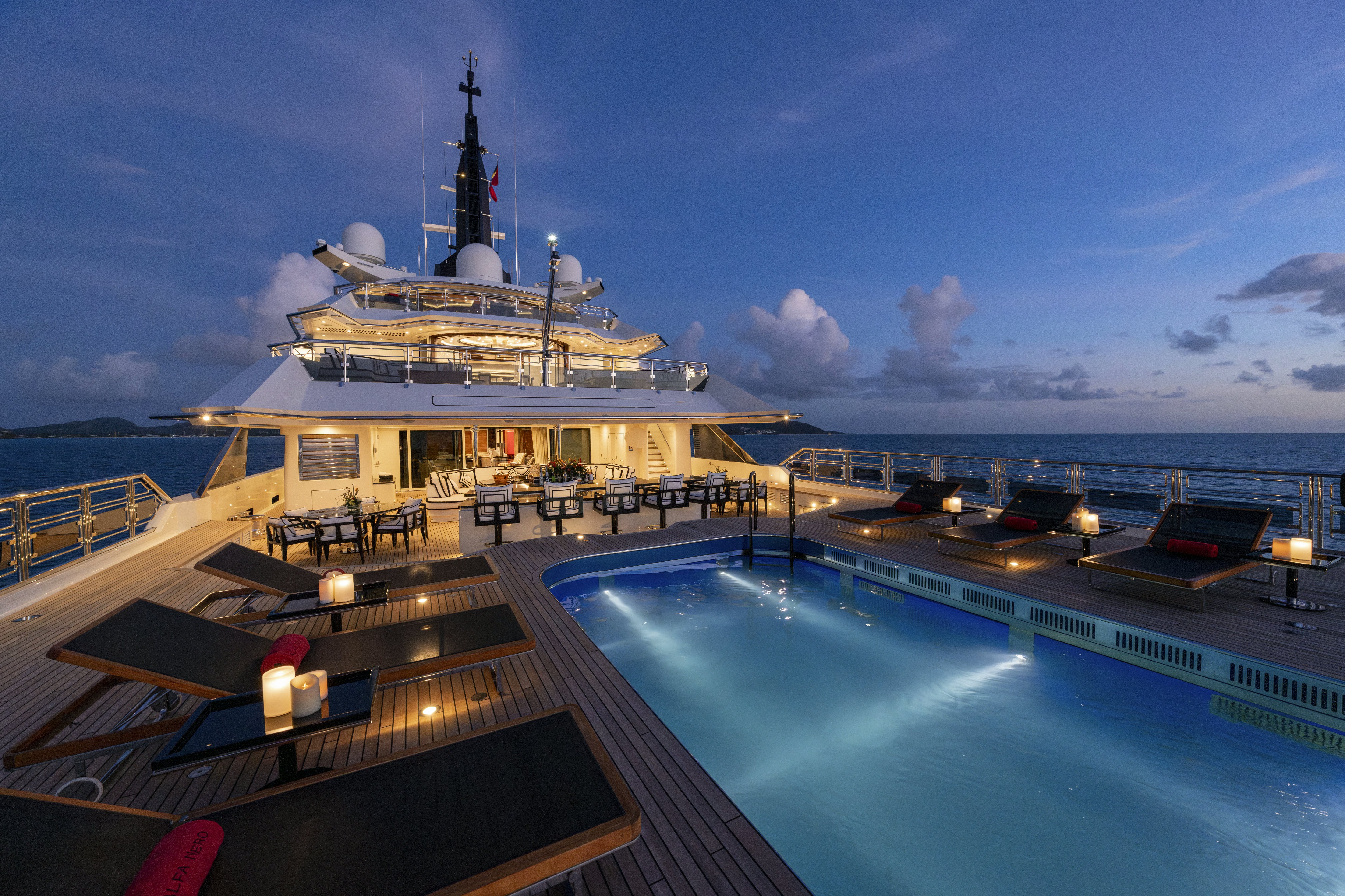 a large white building with a tower by a body of water aboard ALFA NERO Yacht for Sale