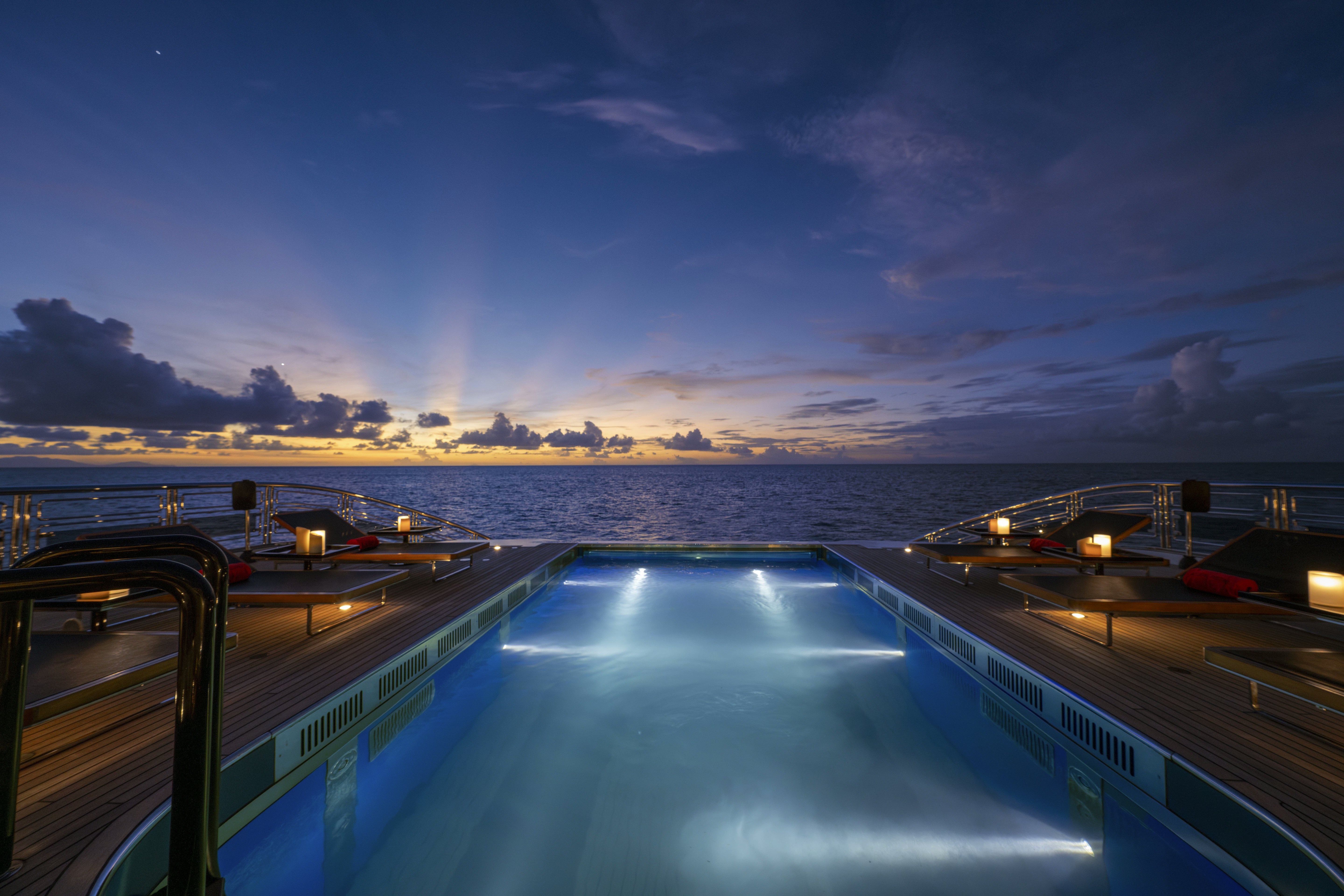 a view of a city at night aboard ALFA NERO Yacht for Sale