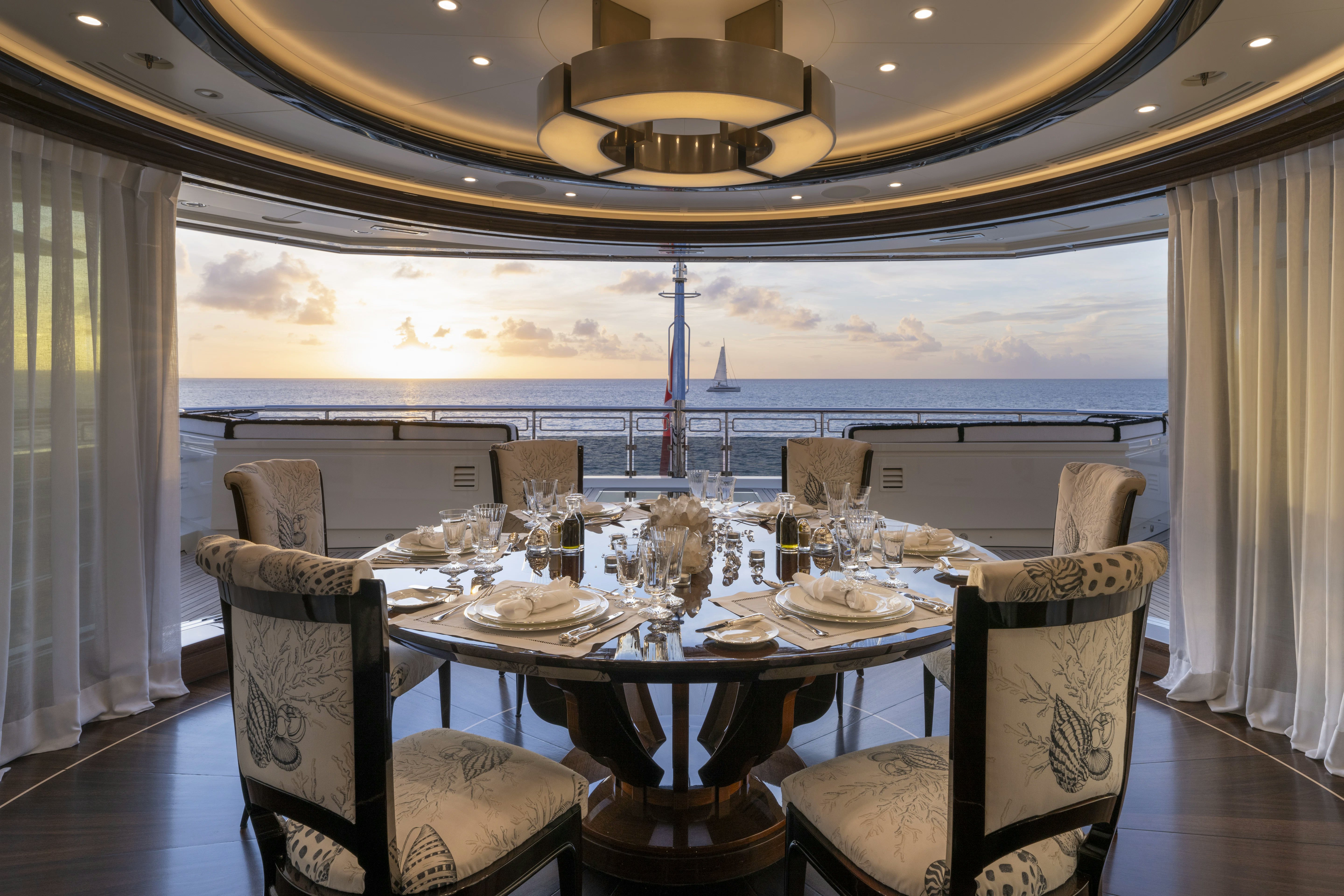 a dining table set for a dinner aboard ALFA NERO Yacht for Sale