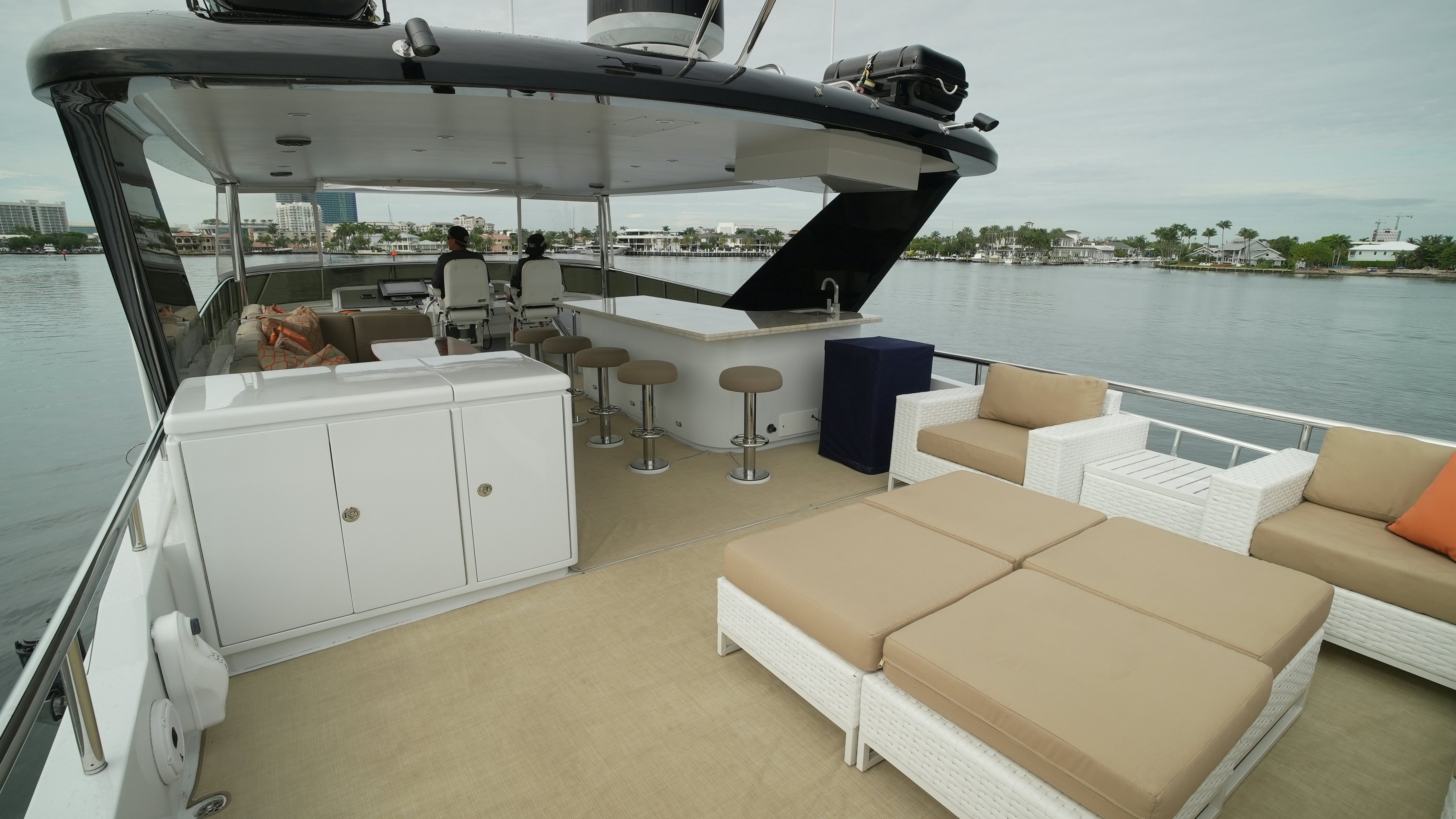 a boat with a white bar and chairs on the deck aboard SEA 2 SEA Yacht for Sale