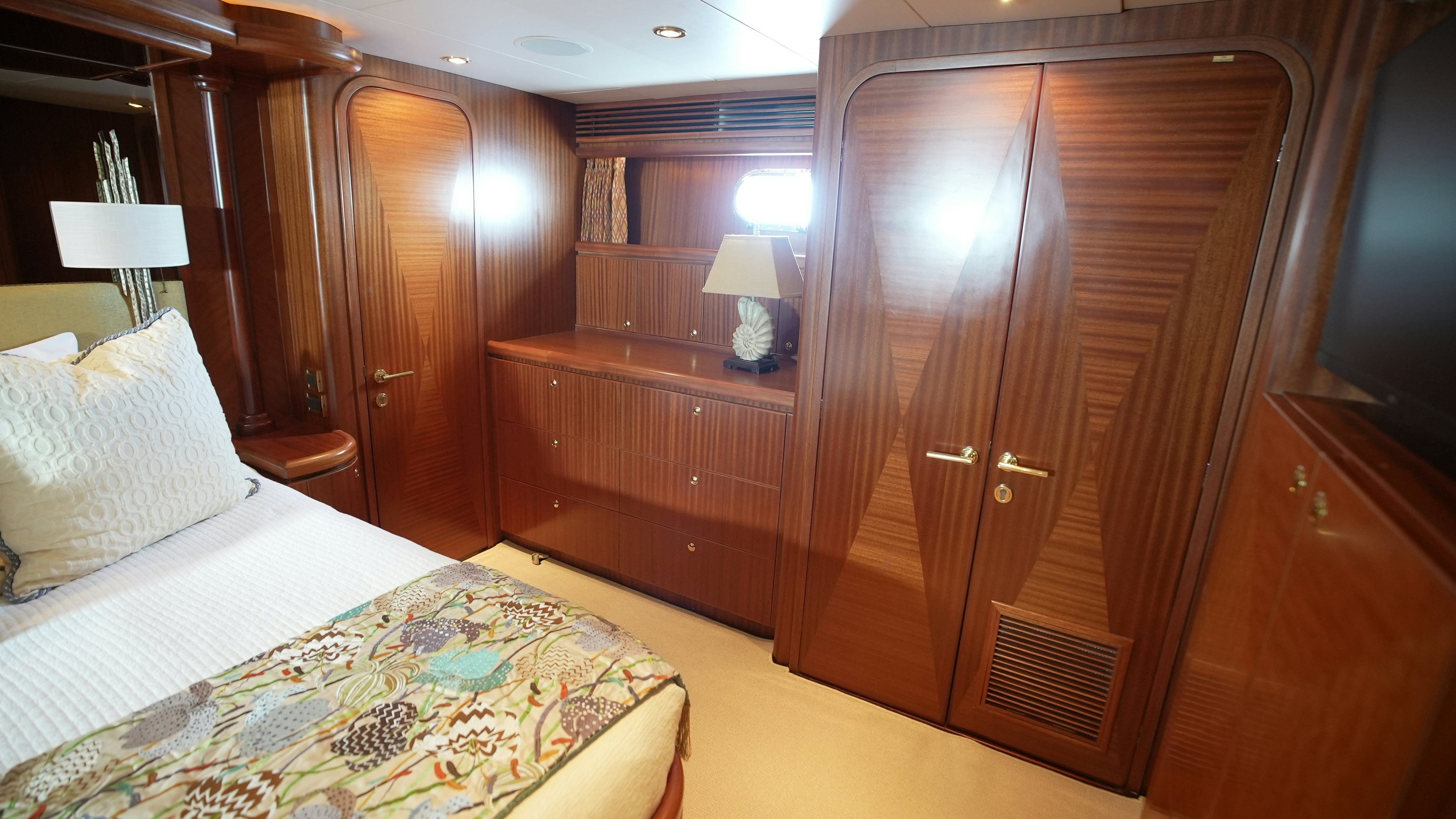 a room with a bed and a closet aboard SEA 2 SEA Yacht for Sale