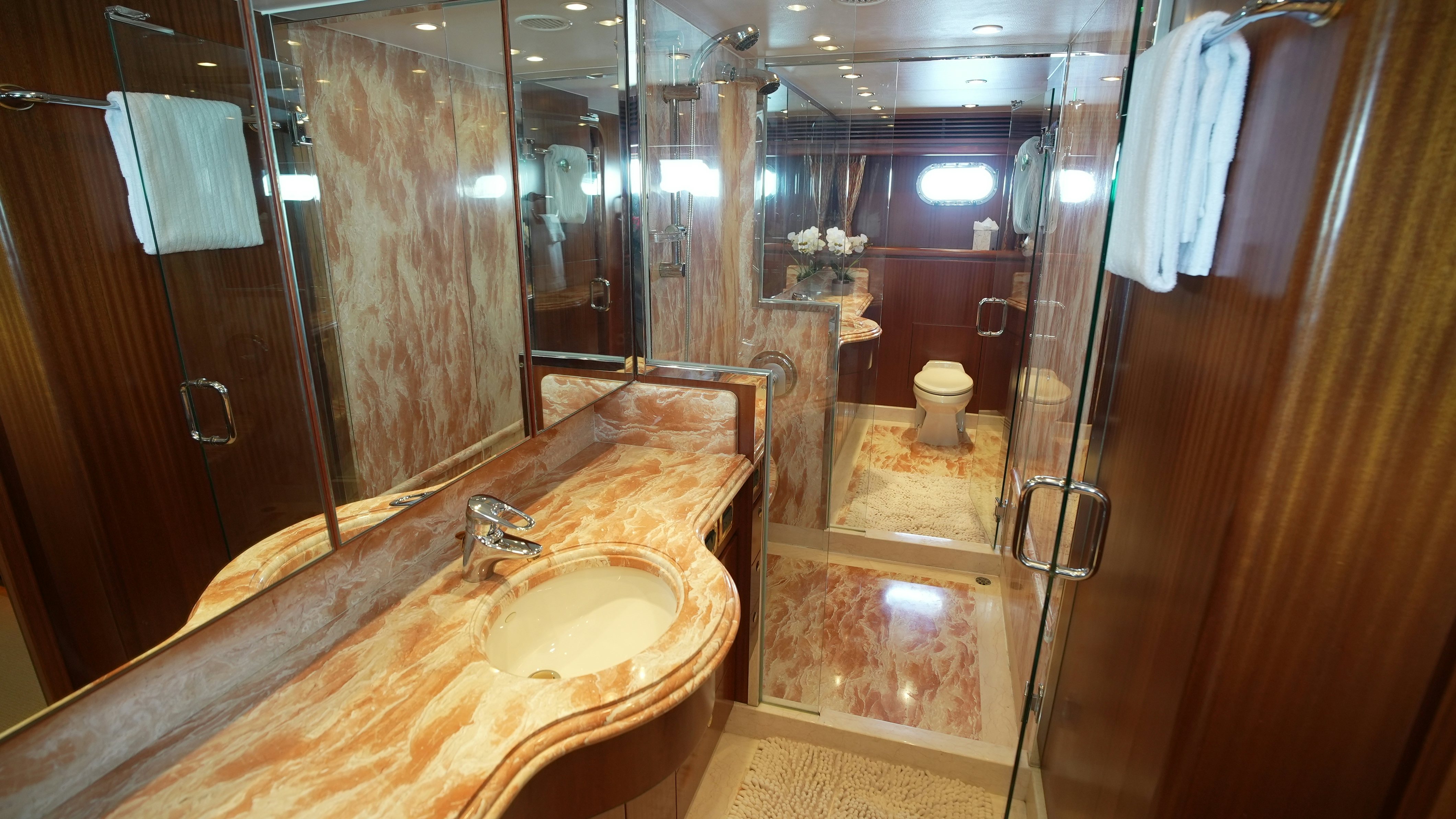 a bathroom with a sink and a mirror aboard SEA 2 SEA Yacht for Sale