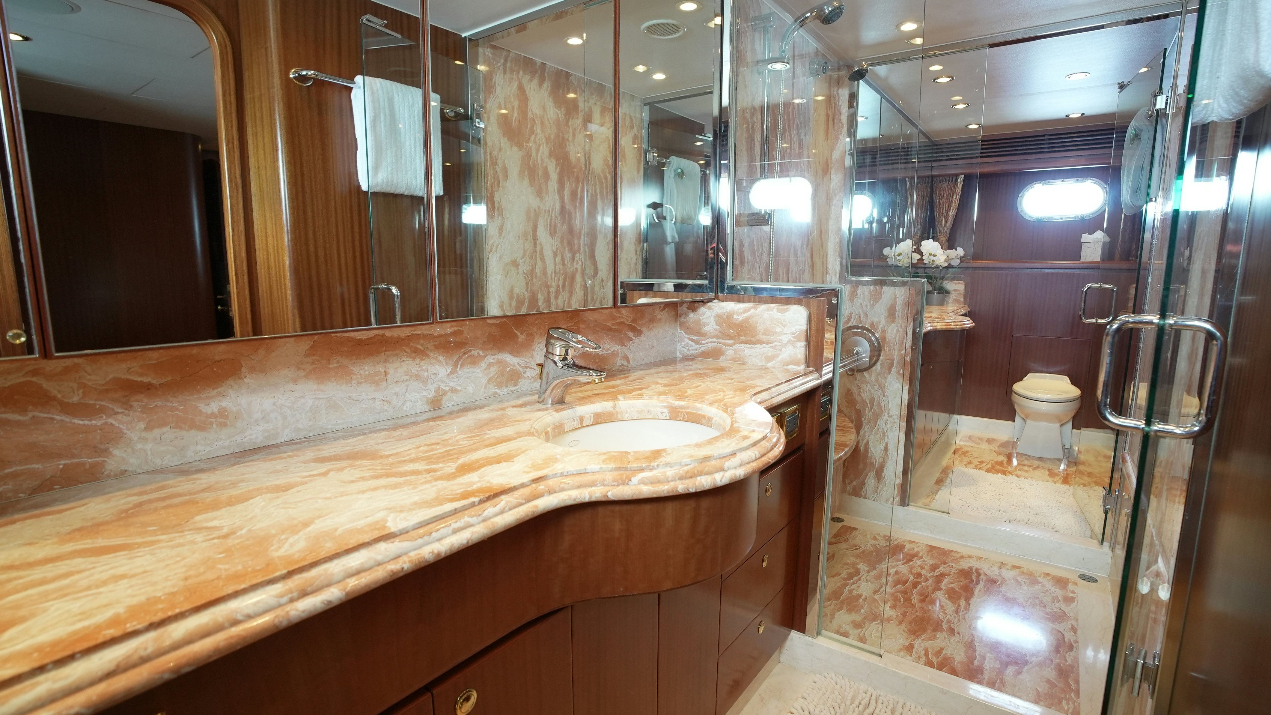 a bathroom with a countertop sink and mirror aboard SEA 2 SEA Yacht for Sale