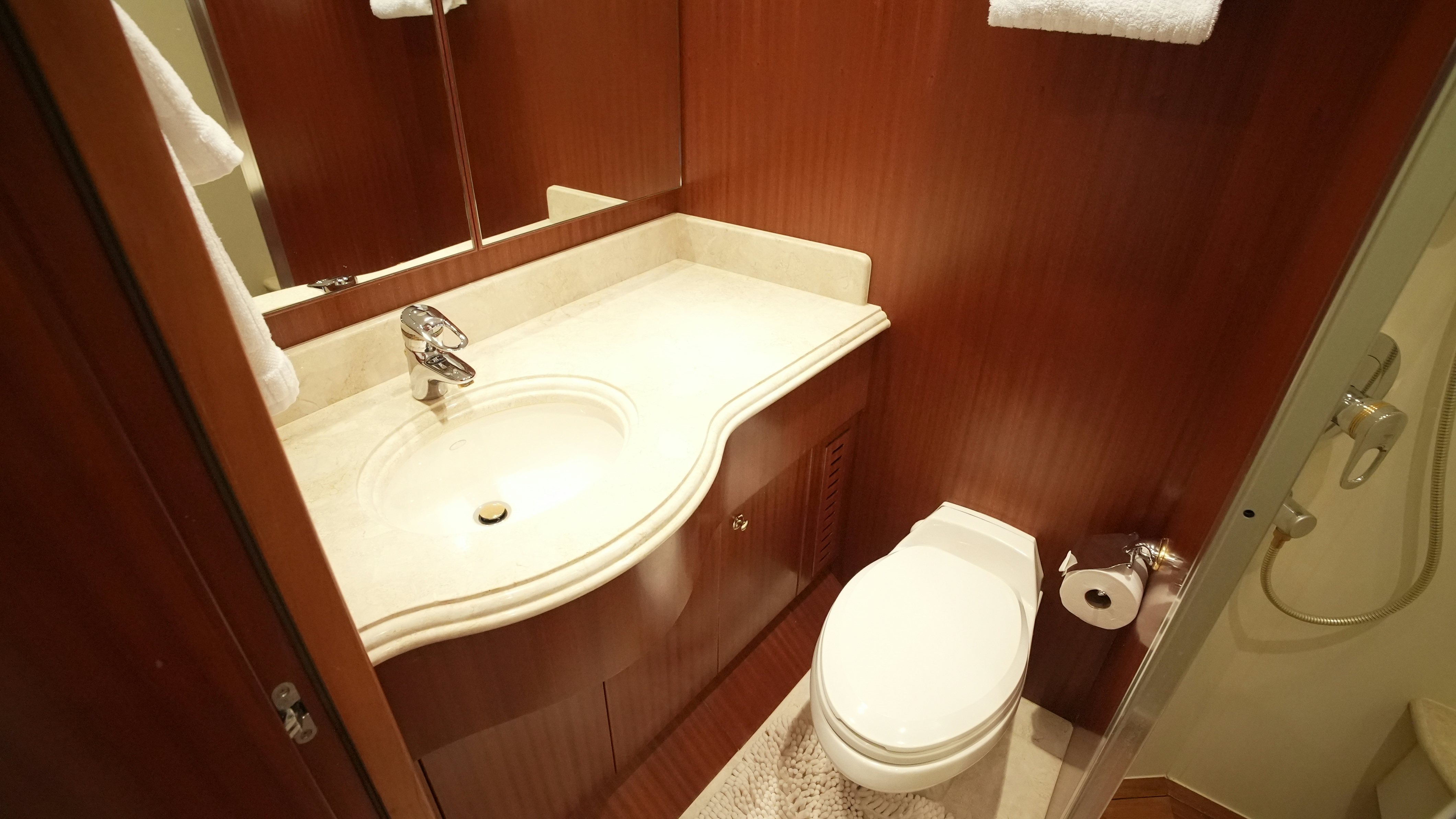 a bathroom with a sink and toilet aboard SEA 2 SEA Yacht for Sale